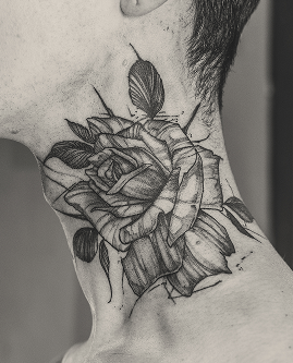 Fine line rose tattoo with leaves on neck by Jay C Tattoo, tattoo artist in Brighton, UK