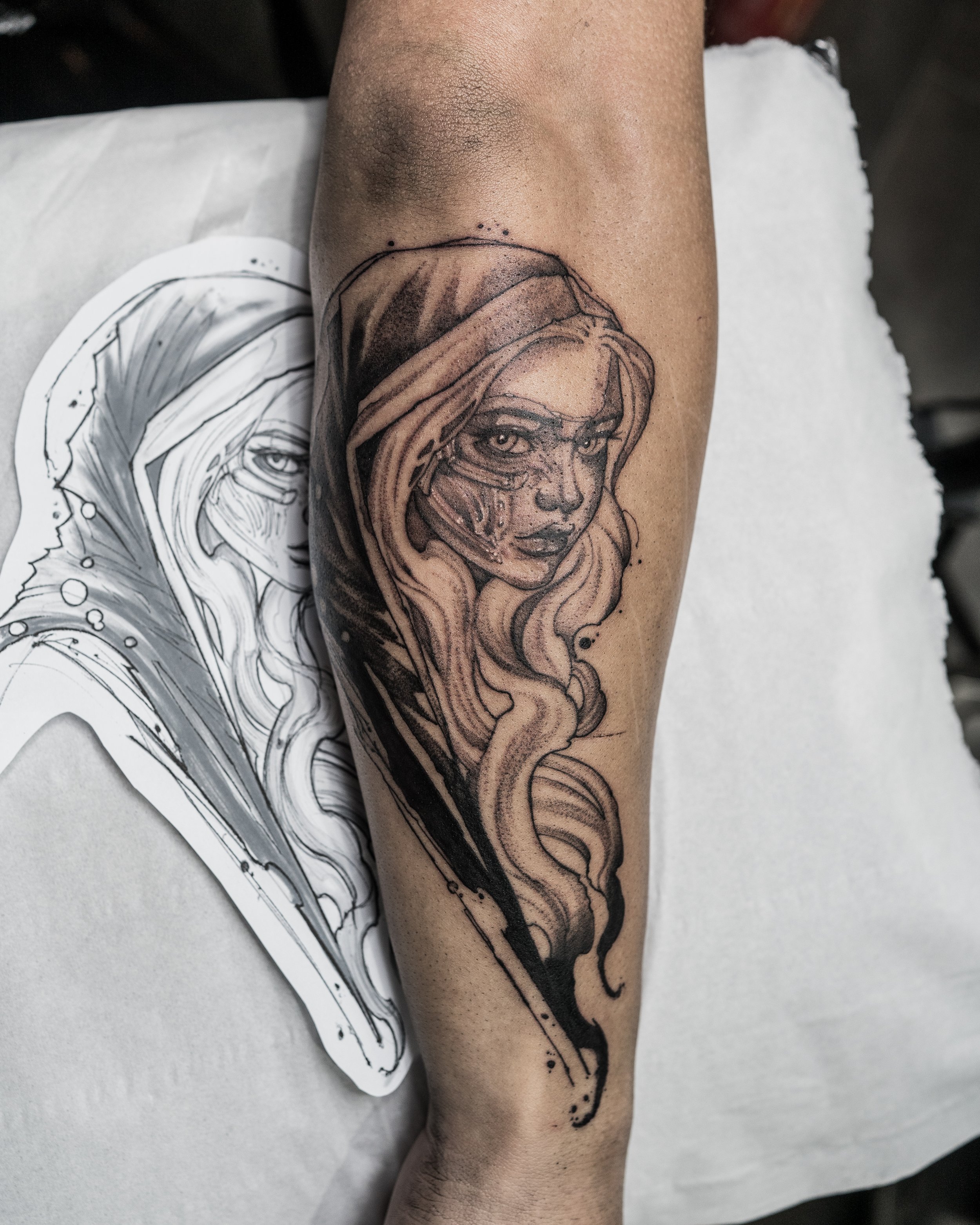 Black and grey portrait tattoo of santa muerte with long hair on arm by Jay C Tattoo, Brighton tattoo artist, UK
