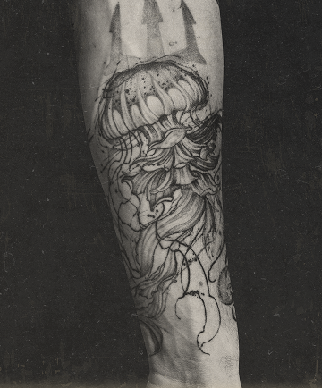 Fine line micro realism jellyfish tattoo with flowing tentacles on forearm by Jay C Tattoo, tattoo artist in Brighton and Hove, UK