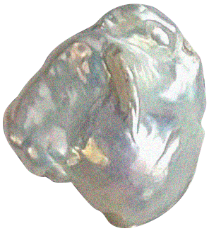 Close-up of a clear, irregularly shaped ice cube with some cloudy areas.
