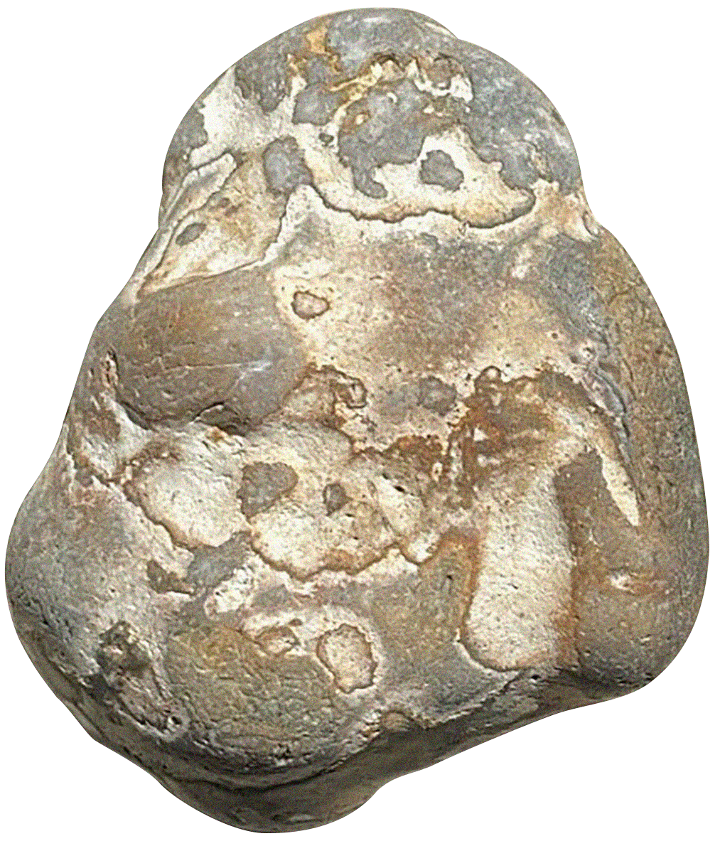 A small, weathered stone with carved designs, resembling a face or mask with circular patterns and abstract features.