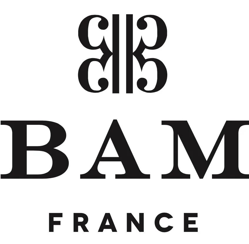 The word "BAM" in large black capital letters with the word "FRANCE" below it, and a decorative symmetrical symbol above.