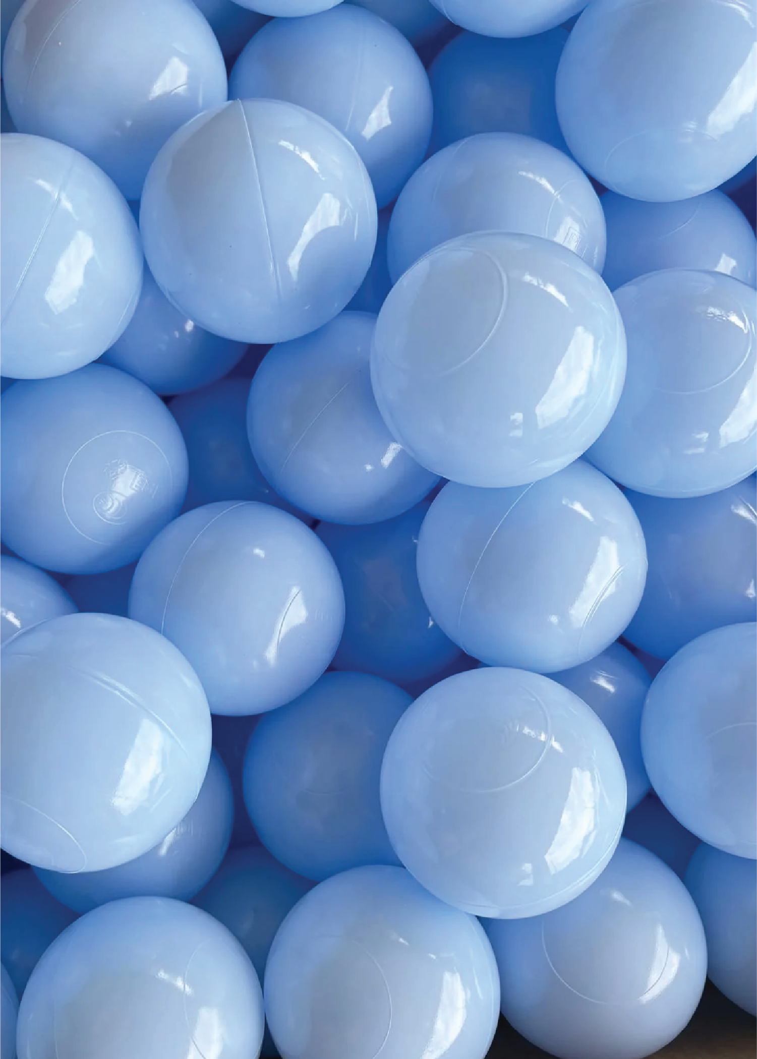 A collection of blue ball pit balls.