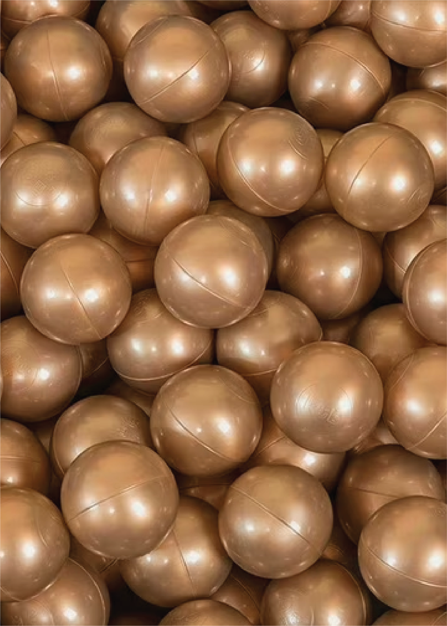 A collection of bronze ball pit balls.