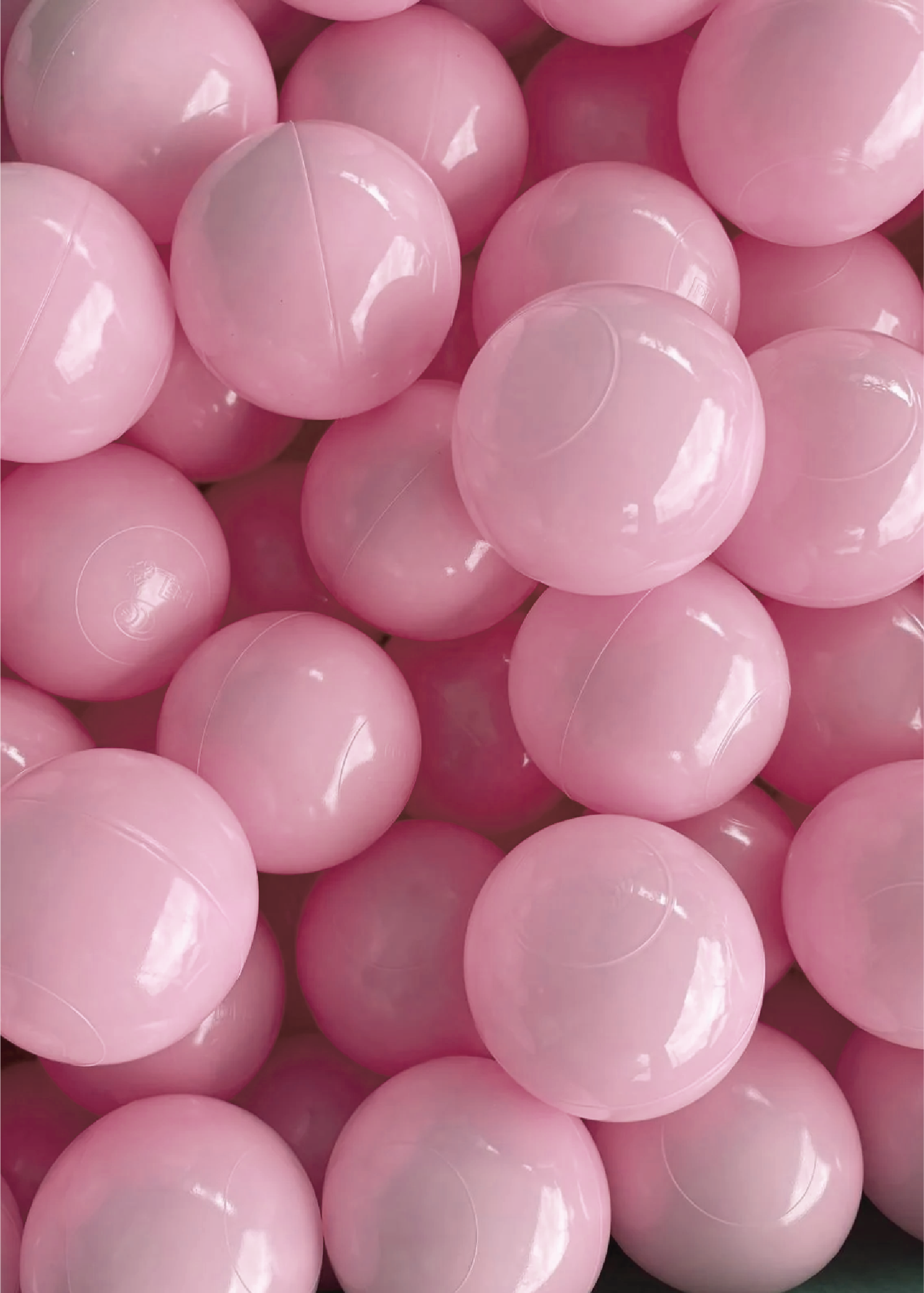 A collection of pink ball pit balls.