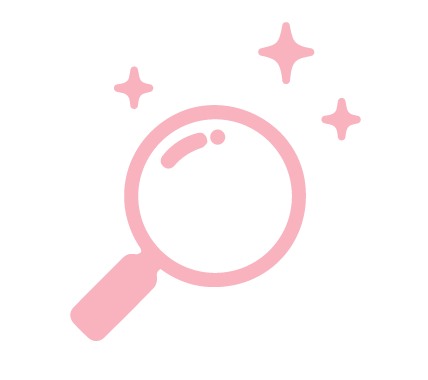 Pink magnifying glass with sparkles around it on a black background.