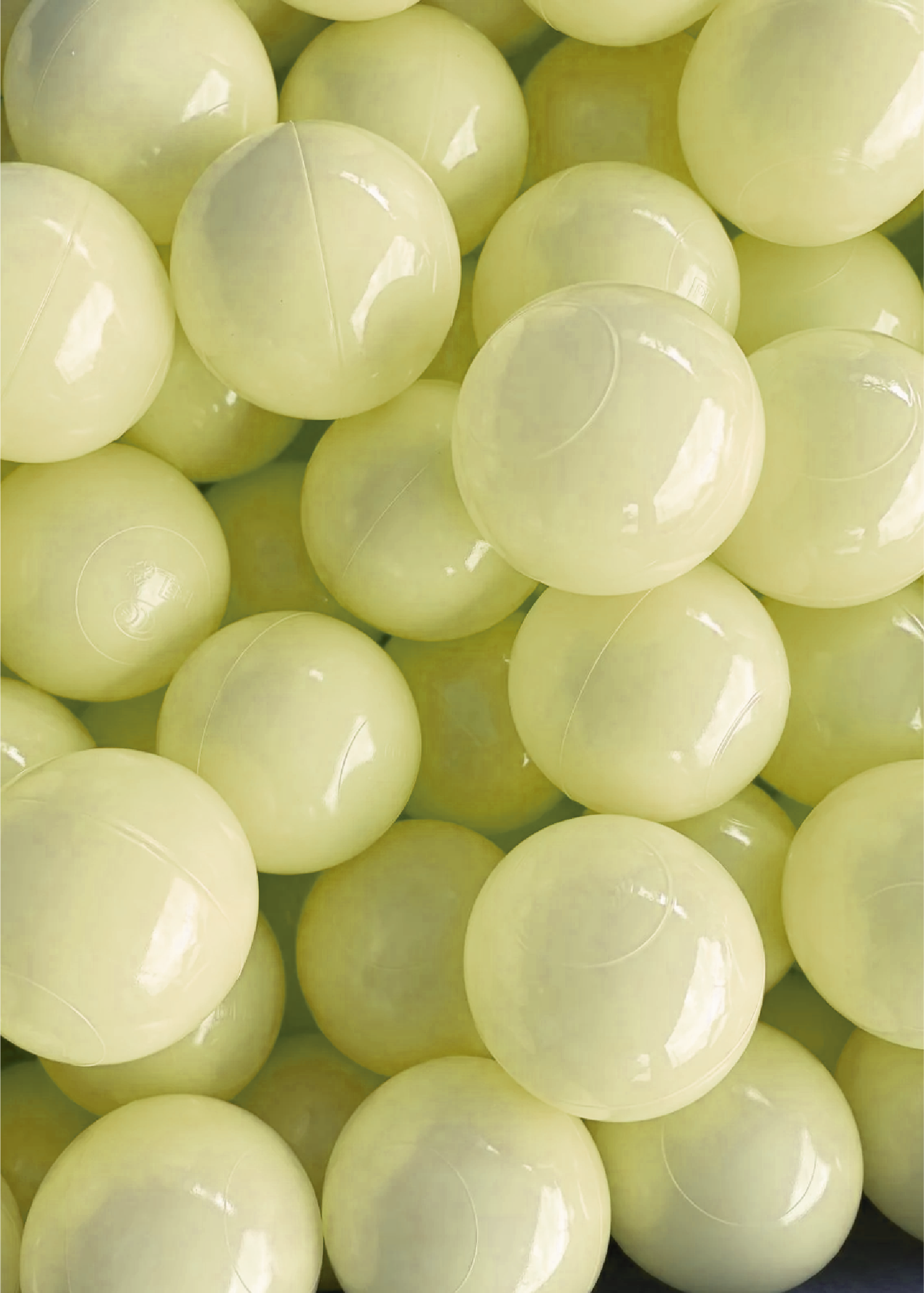 A collection of butter yellow colored ball pit balls.
