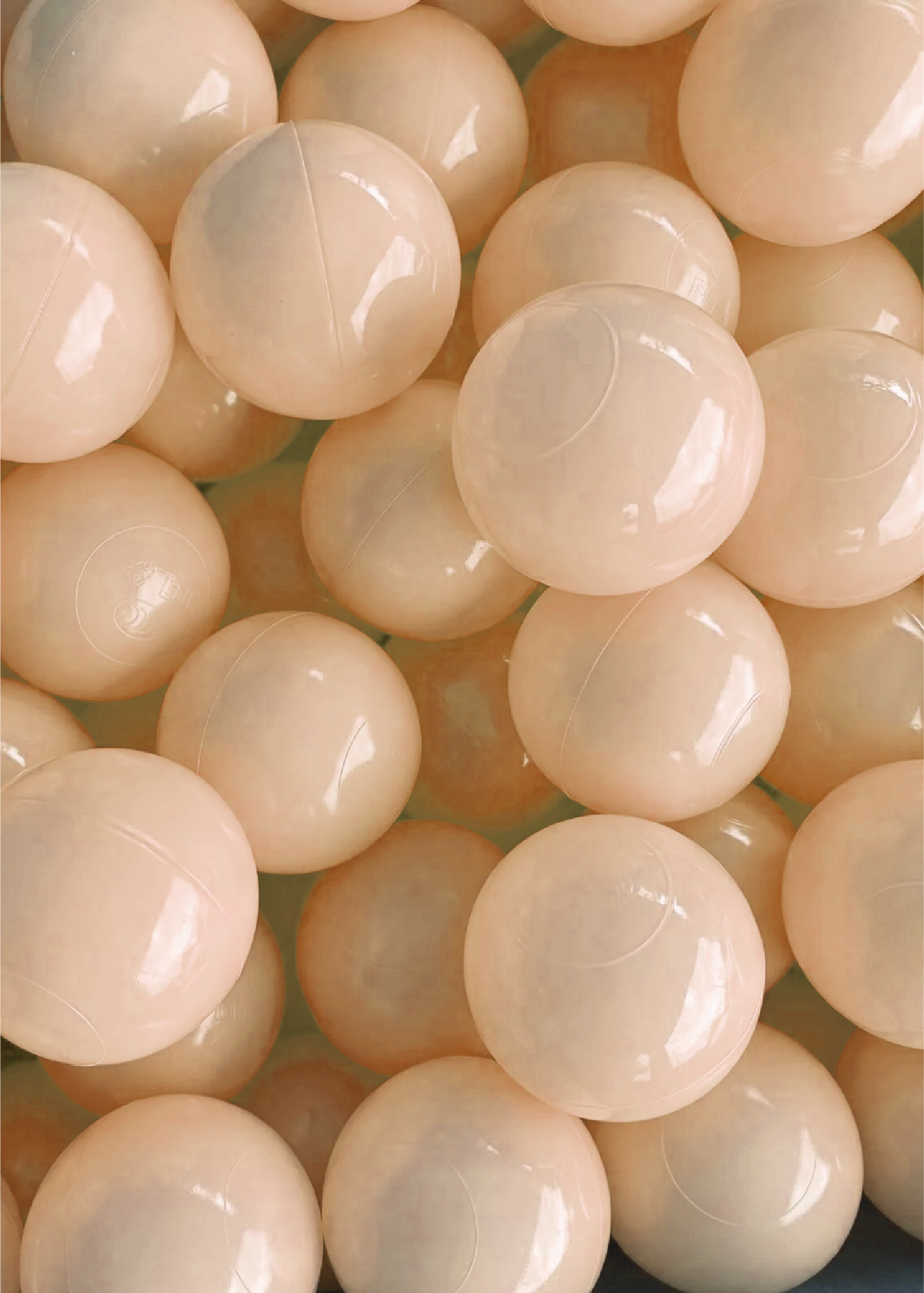 A collection of apricot ball pit balls.