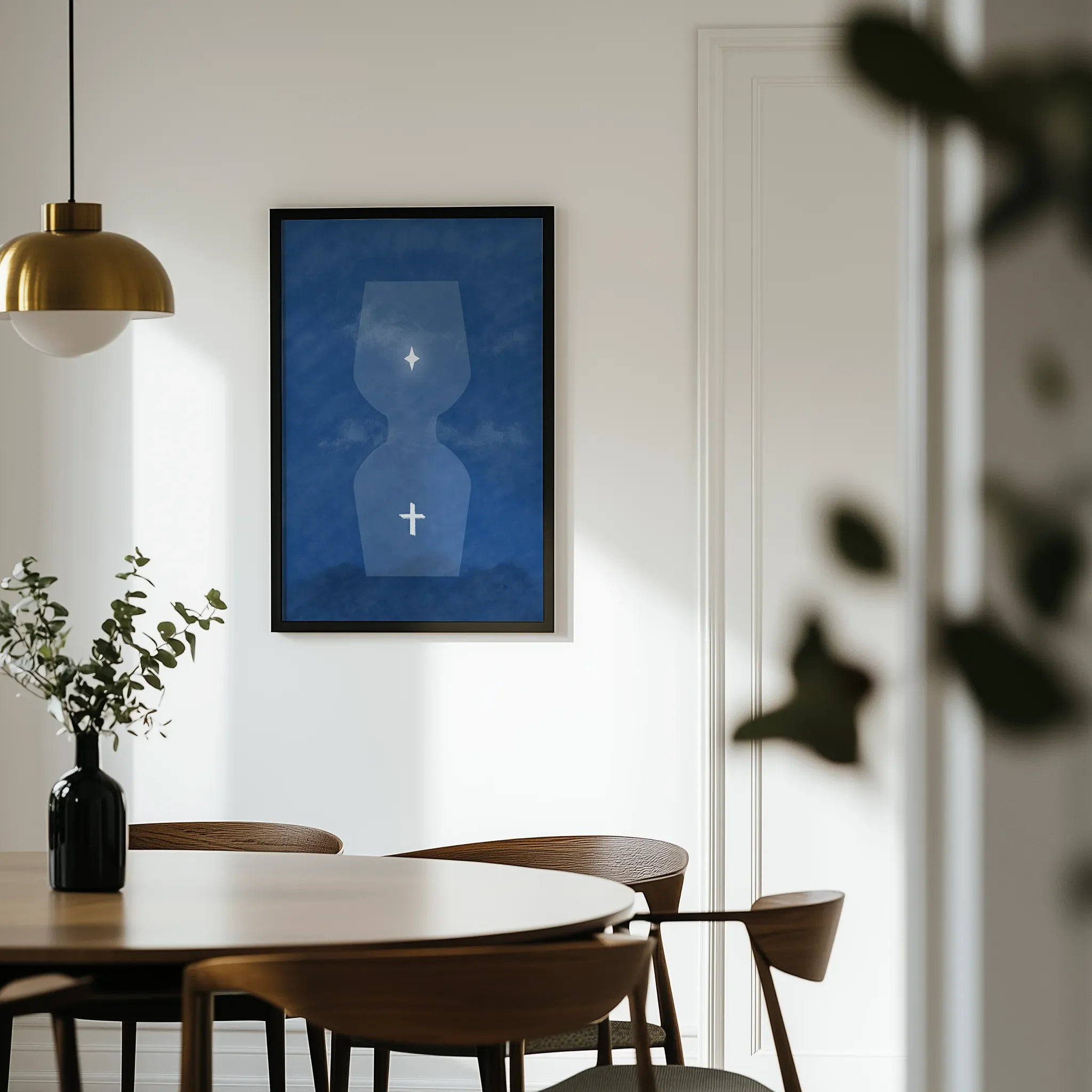 Displayed in a light dining room with a wooden round table and chairs.
