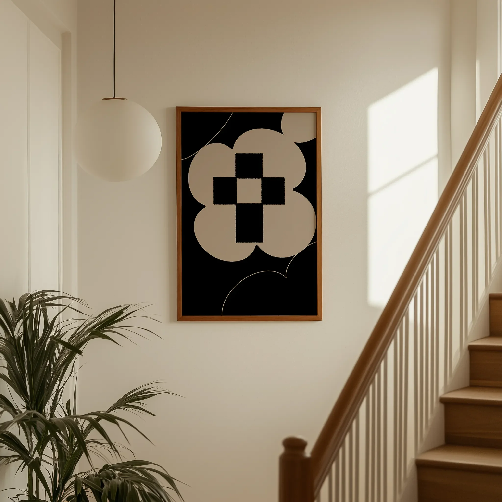 Displayed on a hallway wall near a staircase with directional natural light.