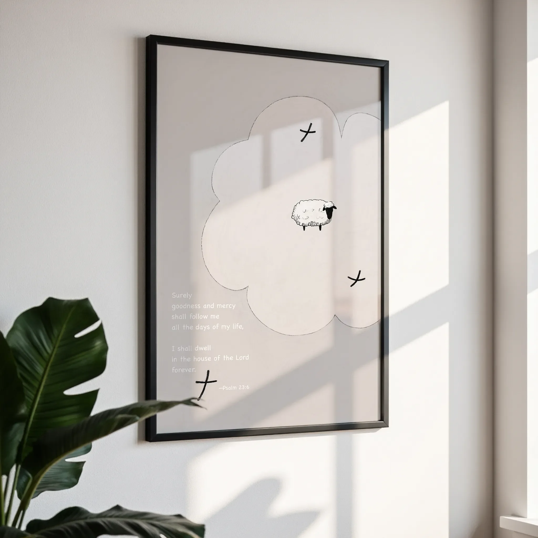 Framed wall art in a simple black frame, photographed from an angled view against a white wall with direct sunlight.