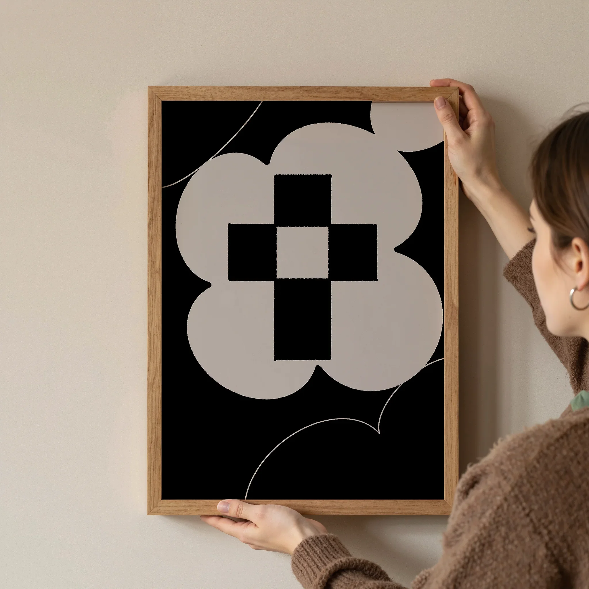 A Christian wall art print featuring cross art poster gentle floral design, shown as a framed artwork being hung on the wall.