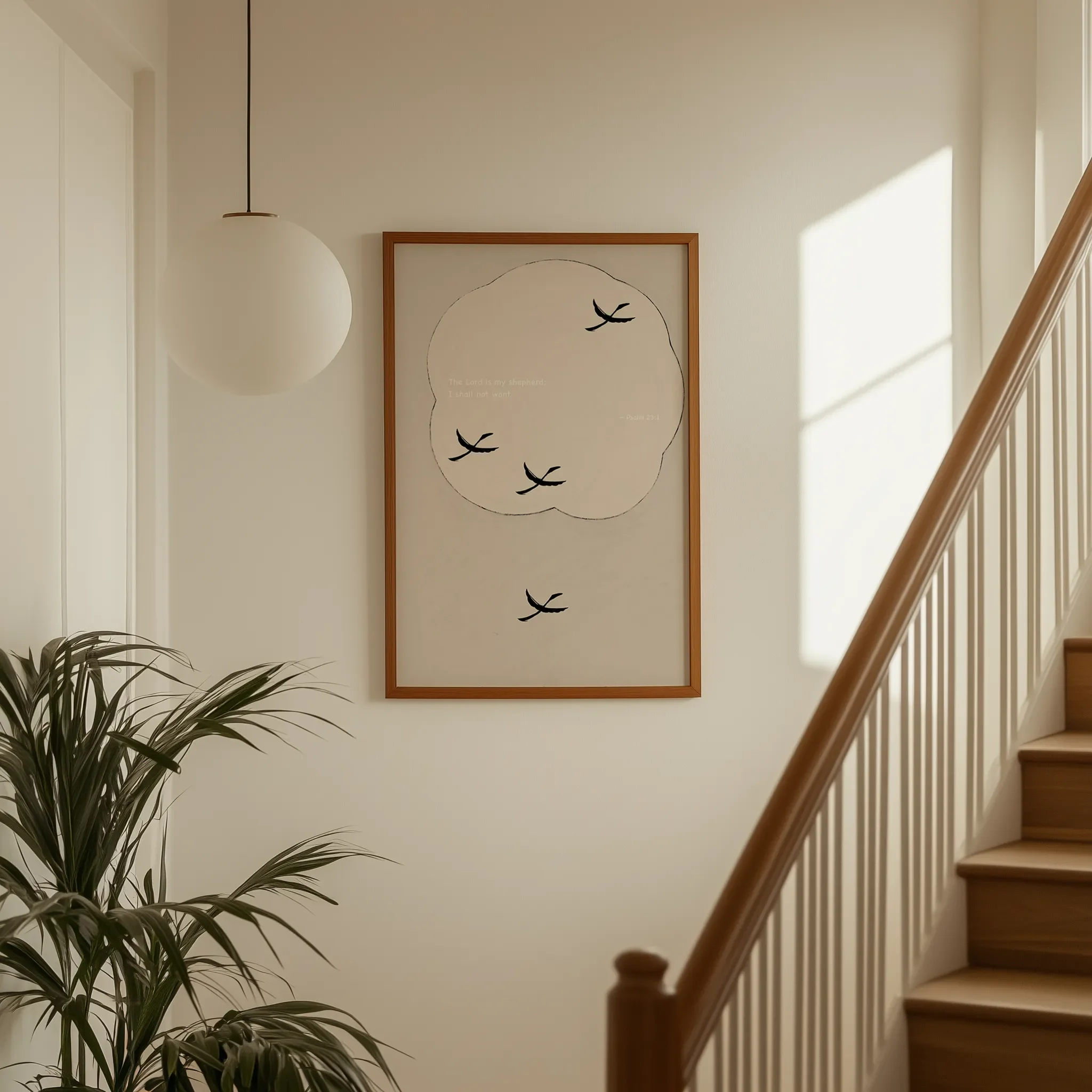 Displayed on a hallway wall near a staircase with directional natural light.
