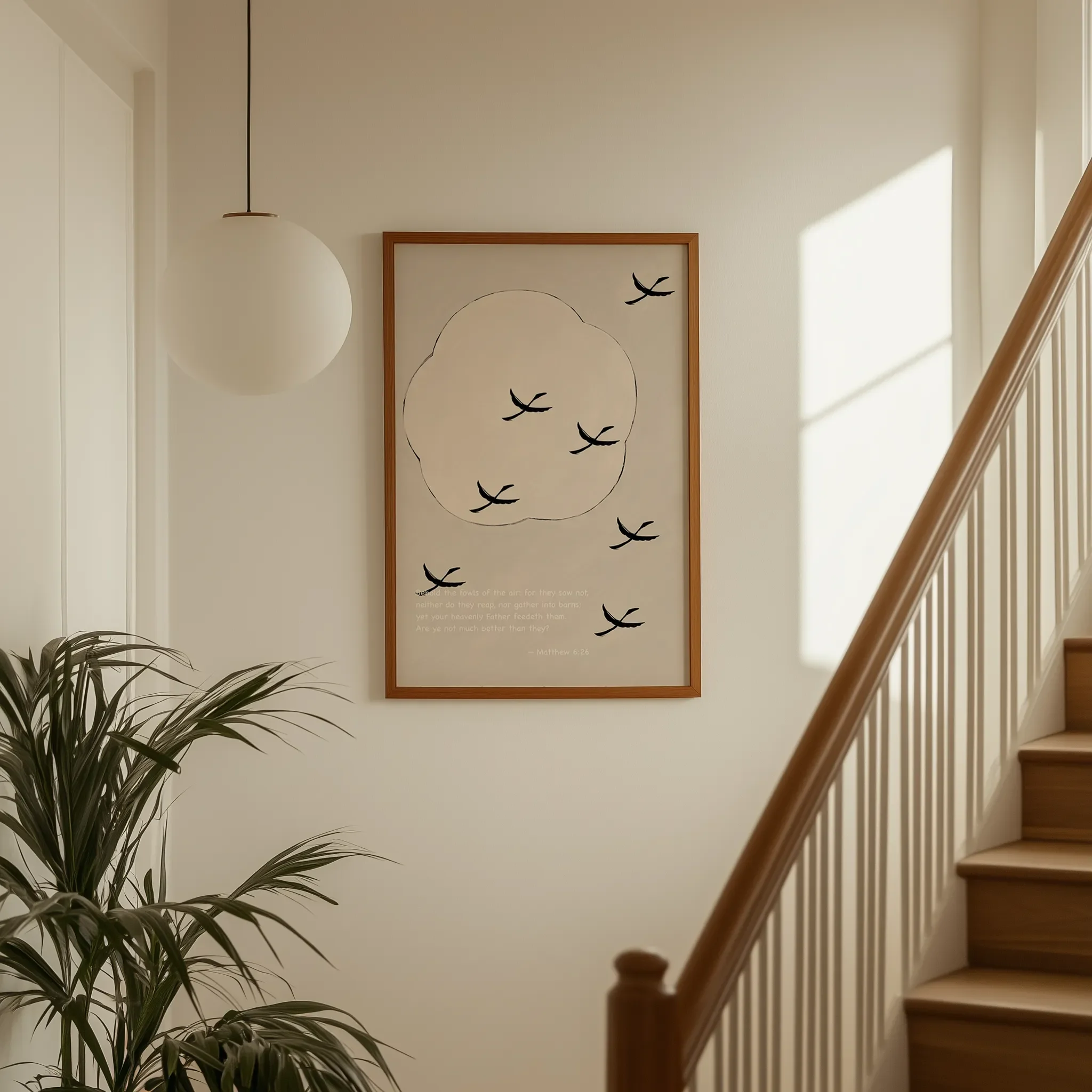 Displayed on a hallway wall near a staircase with directional natural light.
