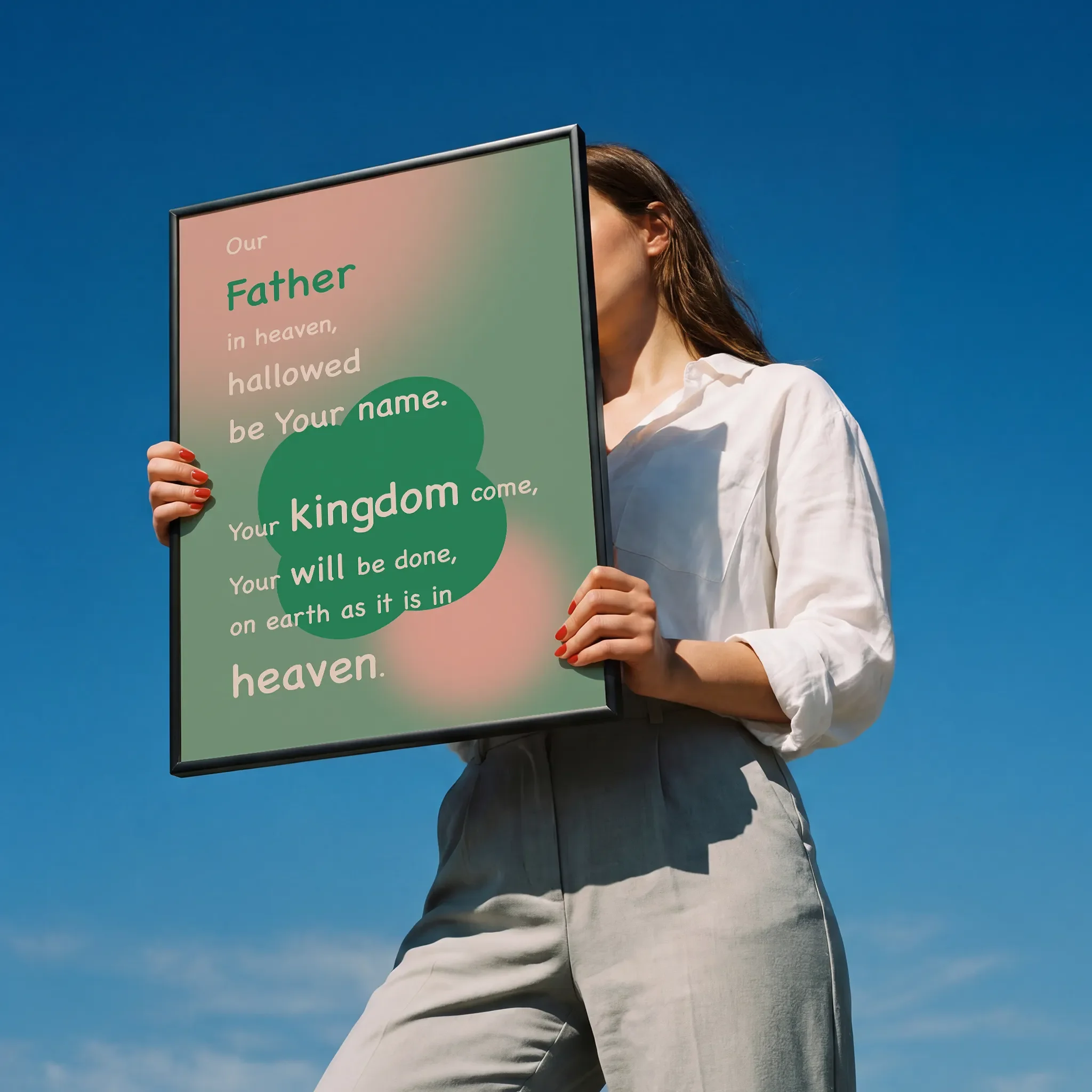 Held by a person in a white shirt outdoors under sunlight.