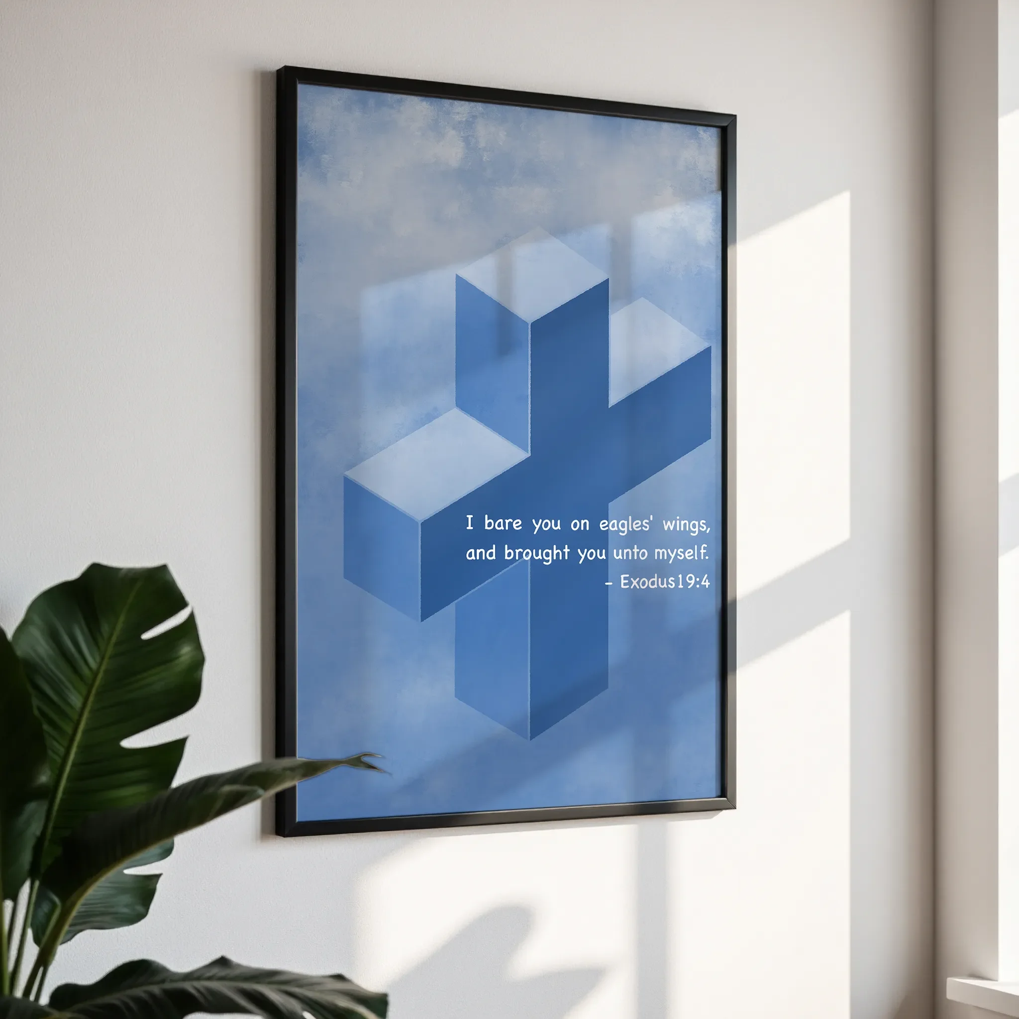 Framed wall art in a simple black frame, photographed from an angled view against a white wall with direct sunlight.