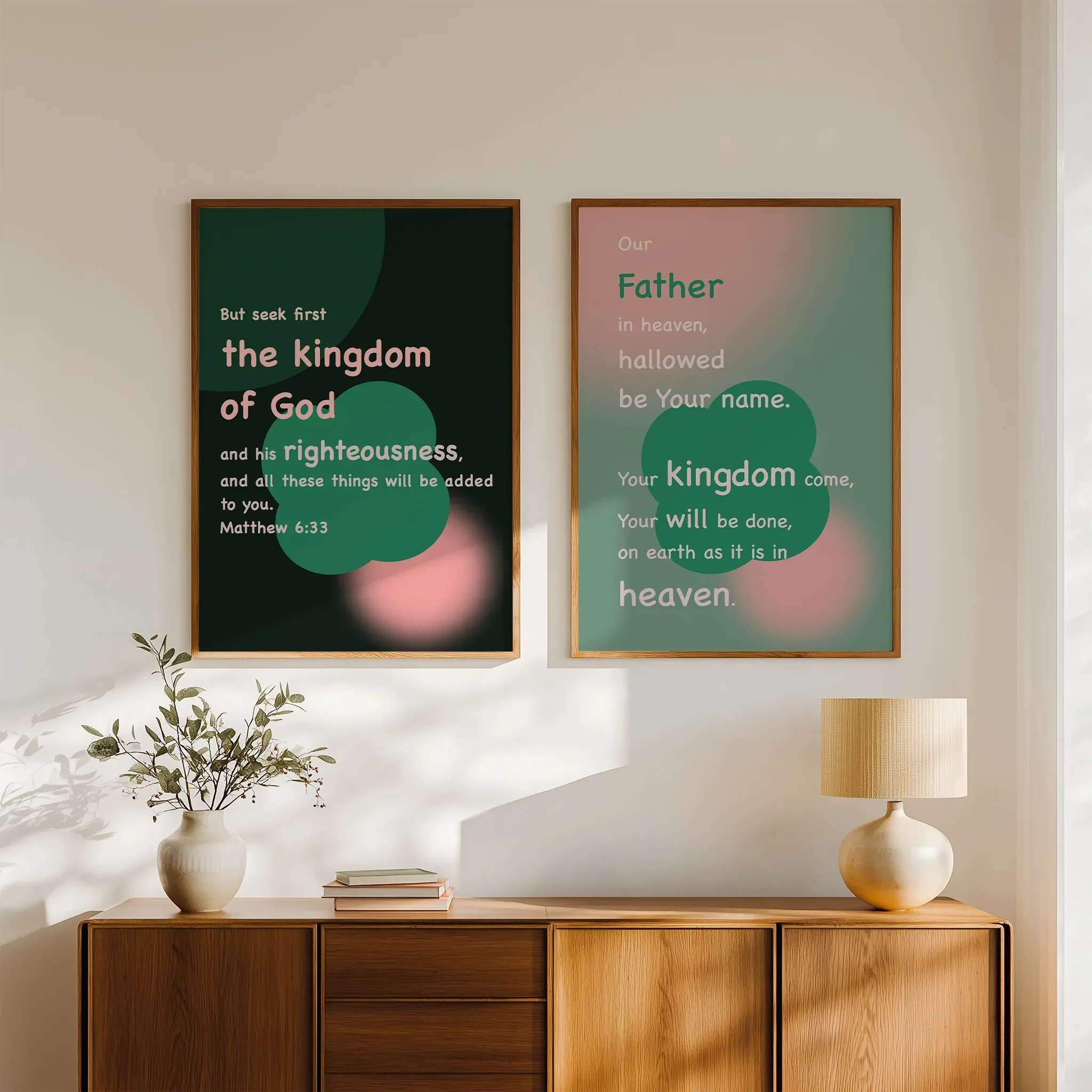 The Lord’s Prayer Collection gallery wall above wooden sideboard, bright room with books and ceramics.