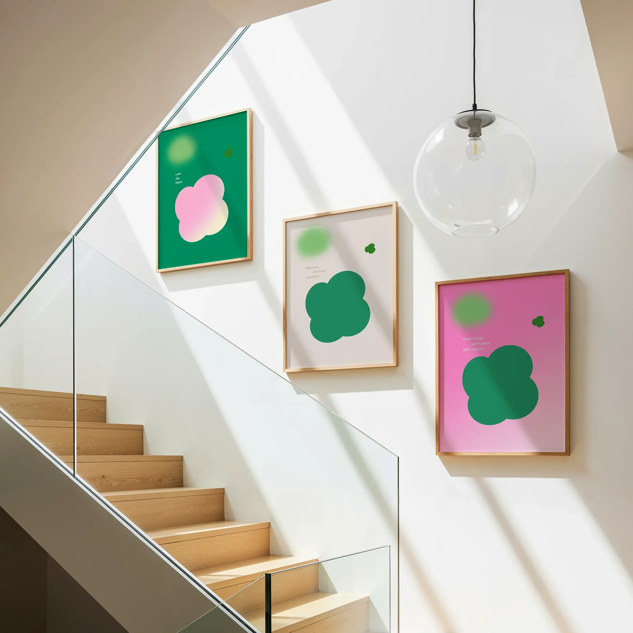 Fruit of the Spirit Collection gallery wall, set of three, displayed above a staircase, illuminated by natural light.