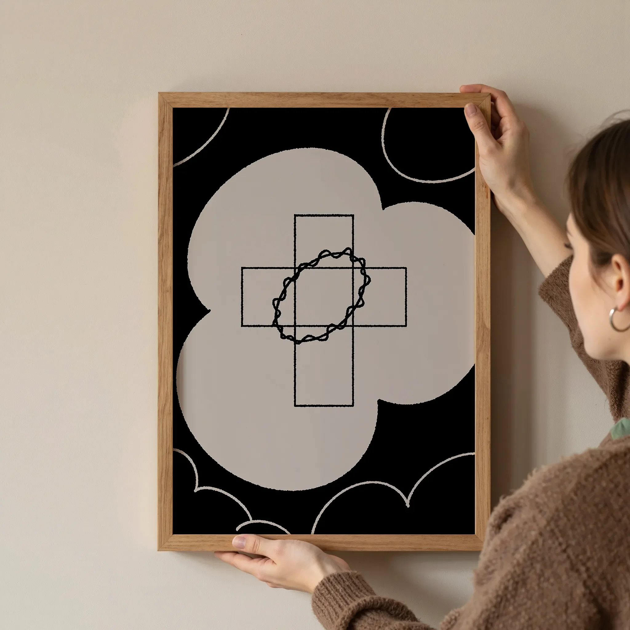 A Christian wall art print featuring cross art poster crown of glory design, shown as a framed artwork being hung on the wall.