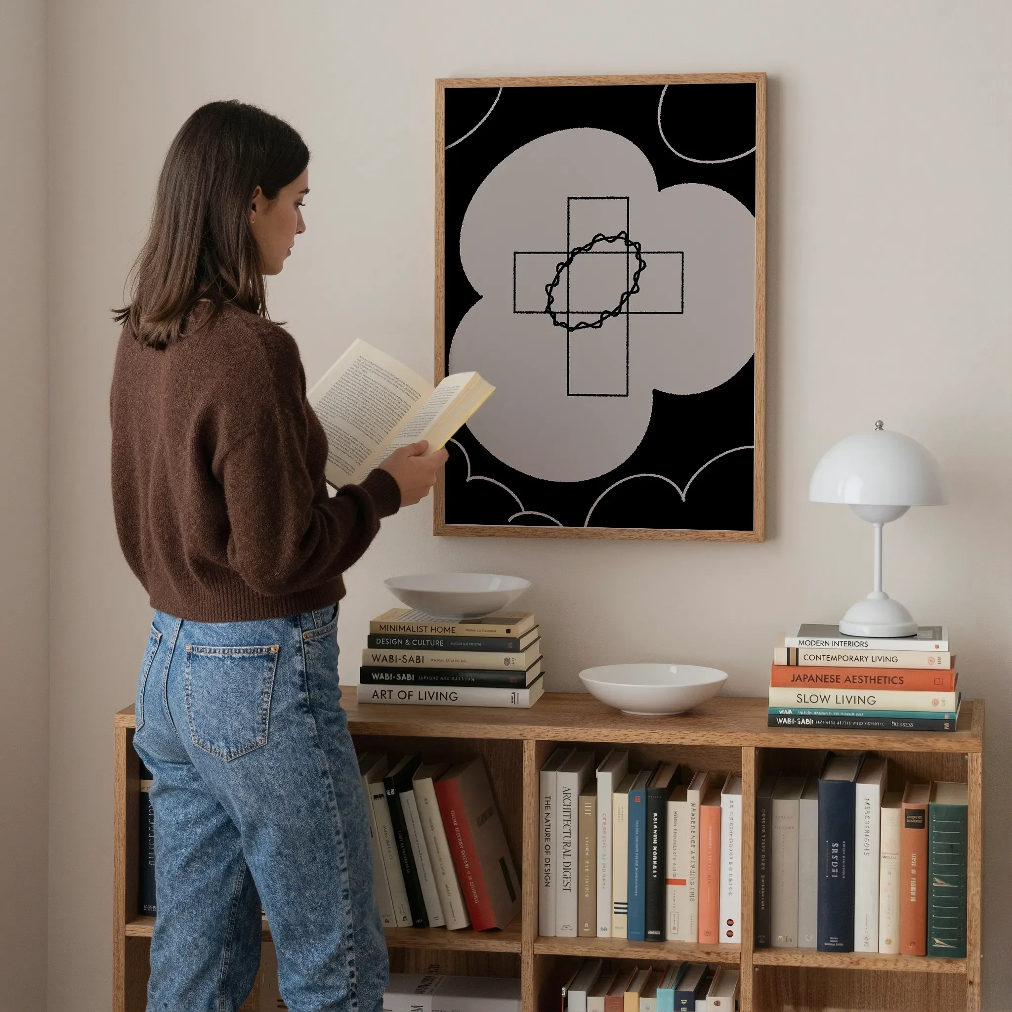 Neutral Christian wall art featuring a floral cross design, displayed above a bookshelf in a quiet personal study.