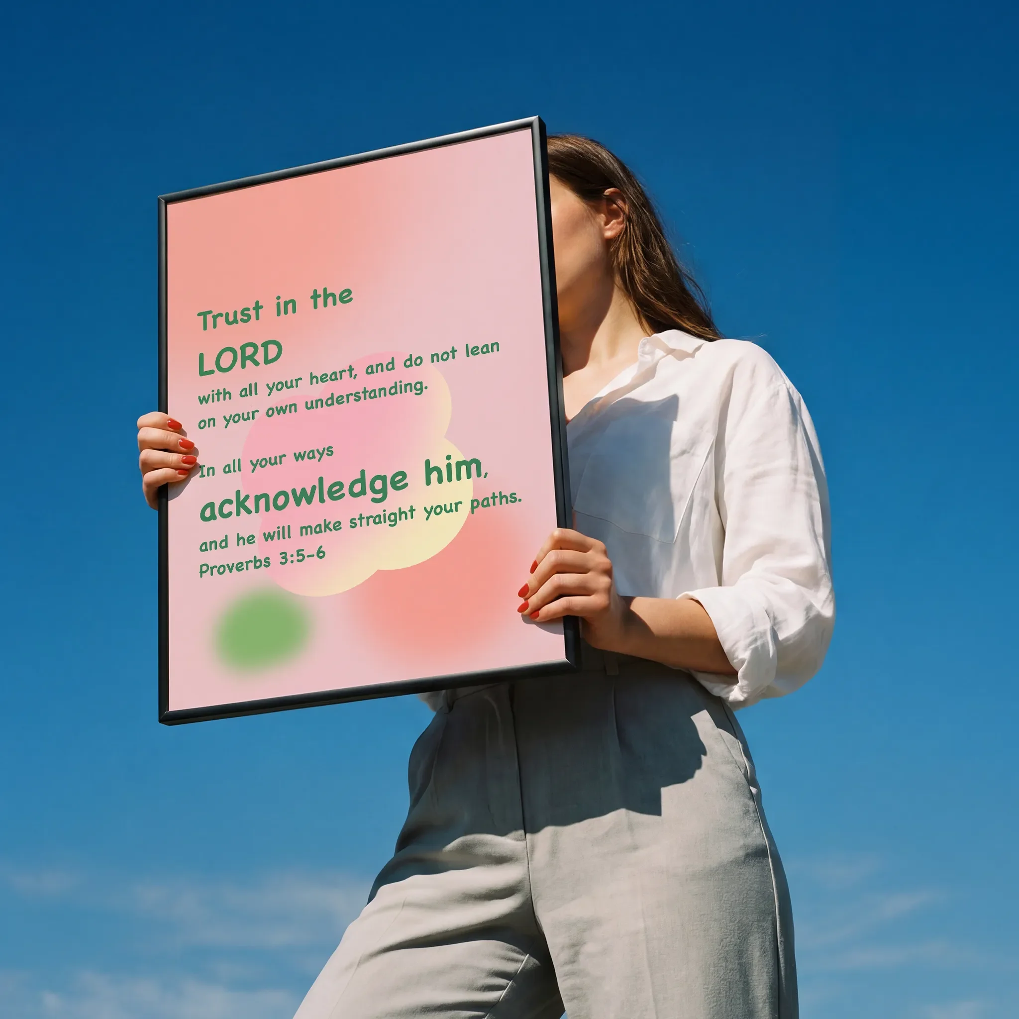 Held by a person in a white shirt outdoors under sunlight.