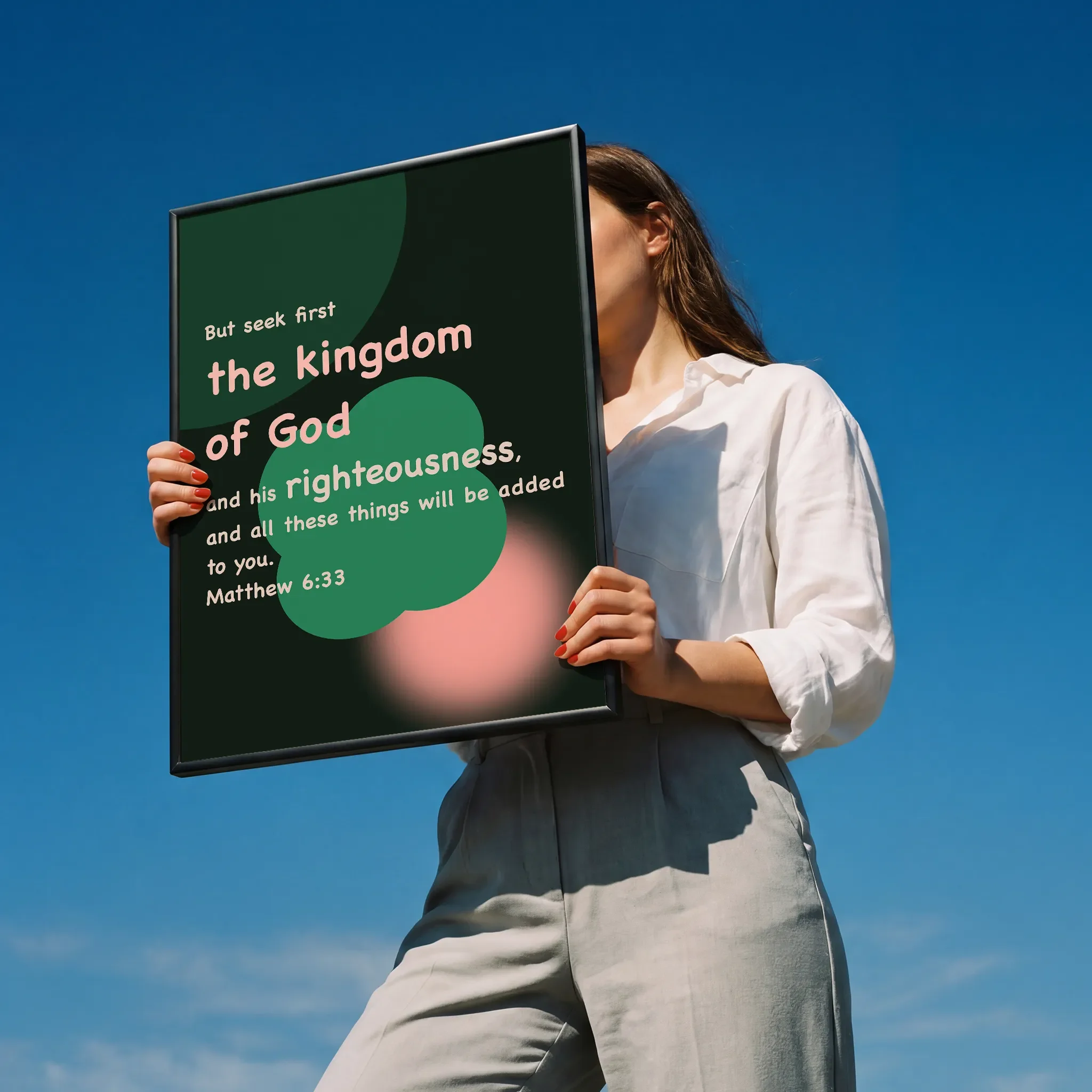 Christian wall art featuring Seek First the Kingdom of God, Held by a person in a white shirt outdoors under sunlight.
