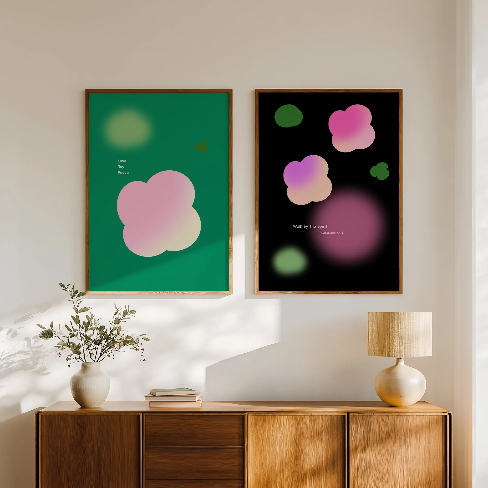 Fruit of the Spirit Collection gallery wall displayed above a wooden sideboard, styled in a bright interior with books and ceramics.