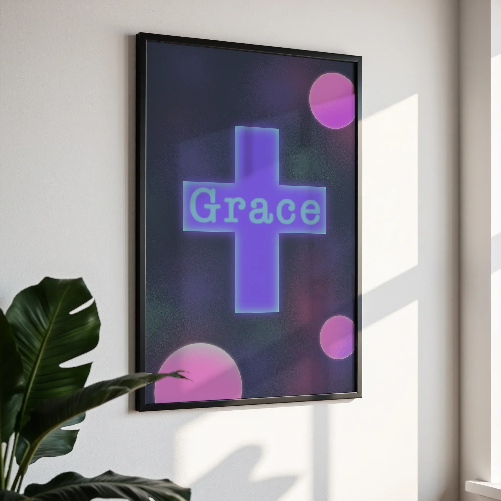 Framed wall art in a simple black frame, photographed from an angled view against a white wall with direct sunlight.