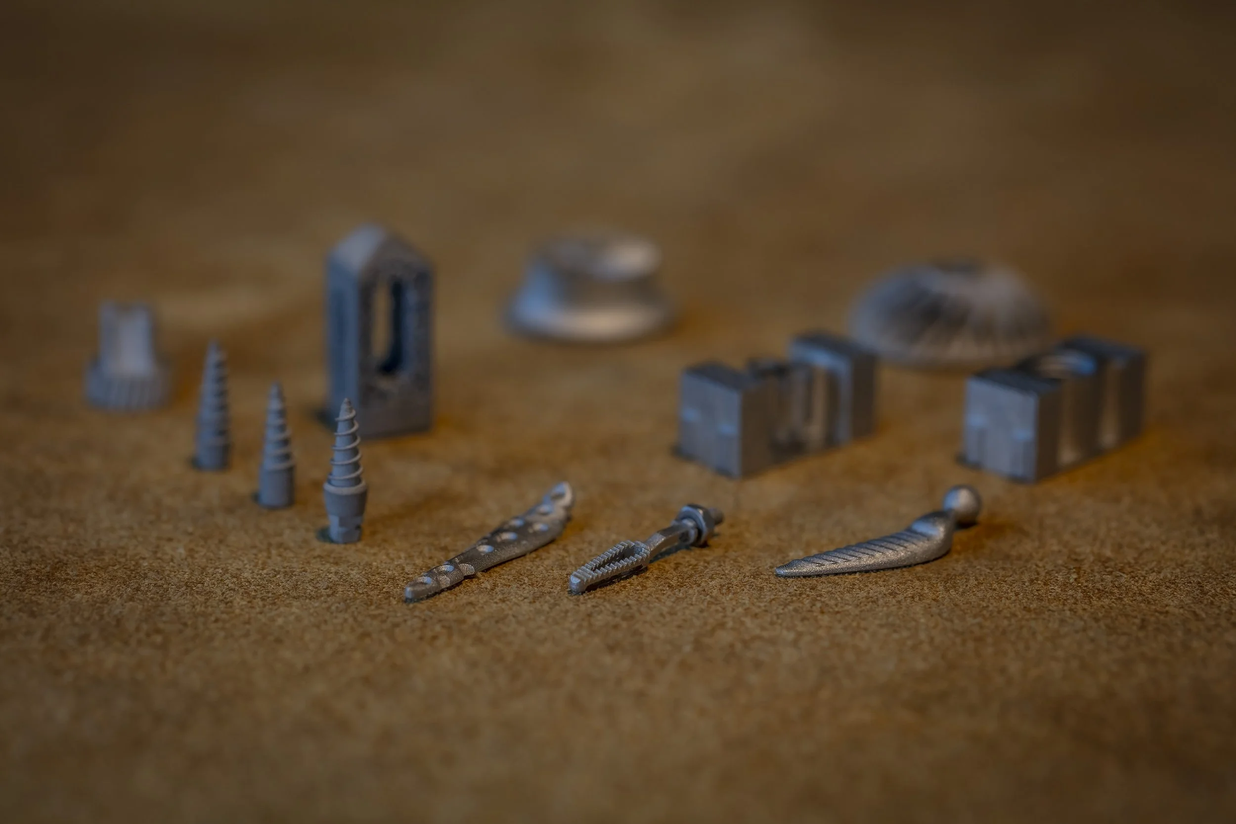 Close-up of small metal parts produced with LMM and showing high detail, high accuracy.