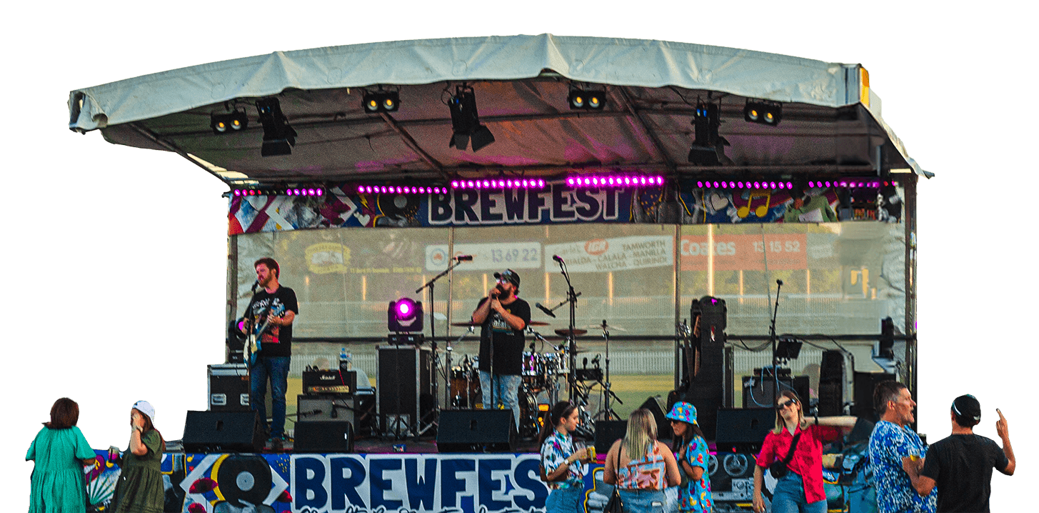A live band (Savage Groove) performing on an outdoor stage at Brewfest Beer & Food Festival. People are standing and chatting in front of it, some holding drinks, with a few wearing colorful summer shirts and hats.