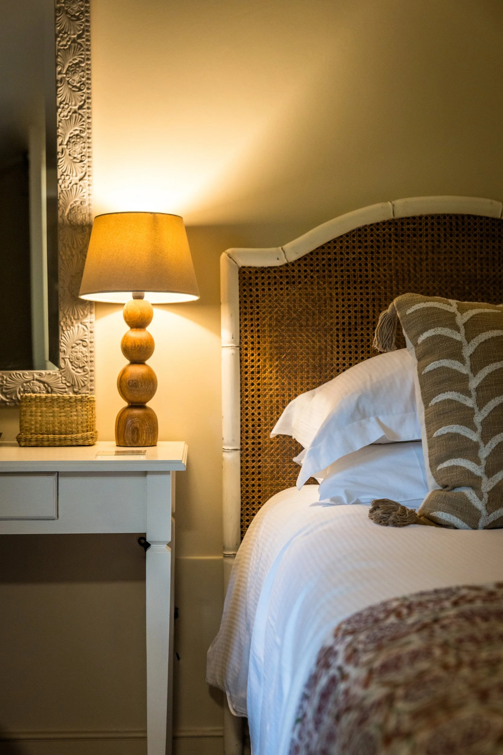 Close-up of a luxury bedroom suite at Loyton Lodge with soft lighting.