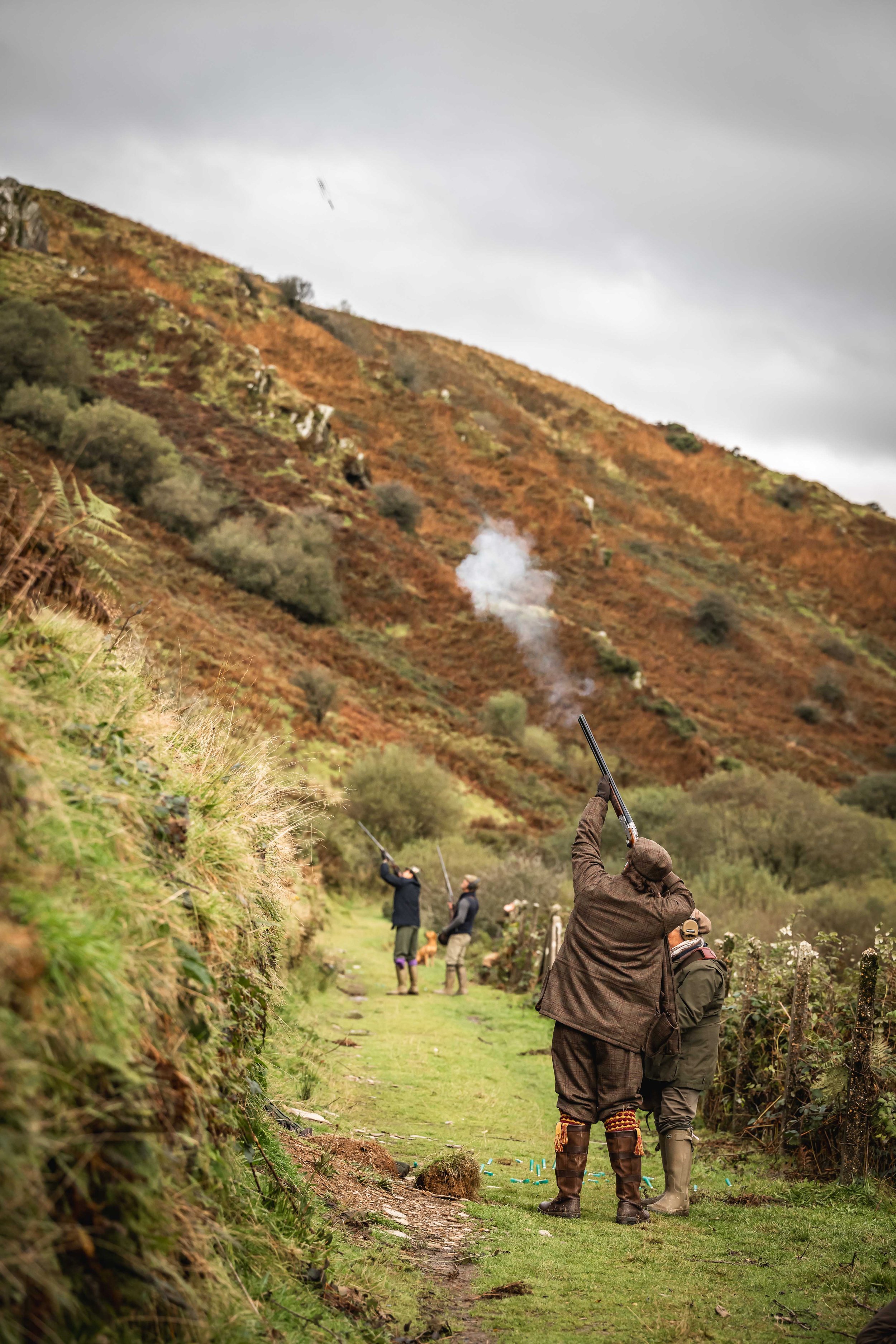 Loyton shoot day guests firing rifles in Bray Valley, Exmoor.