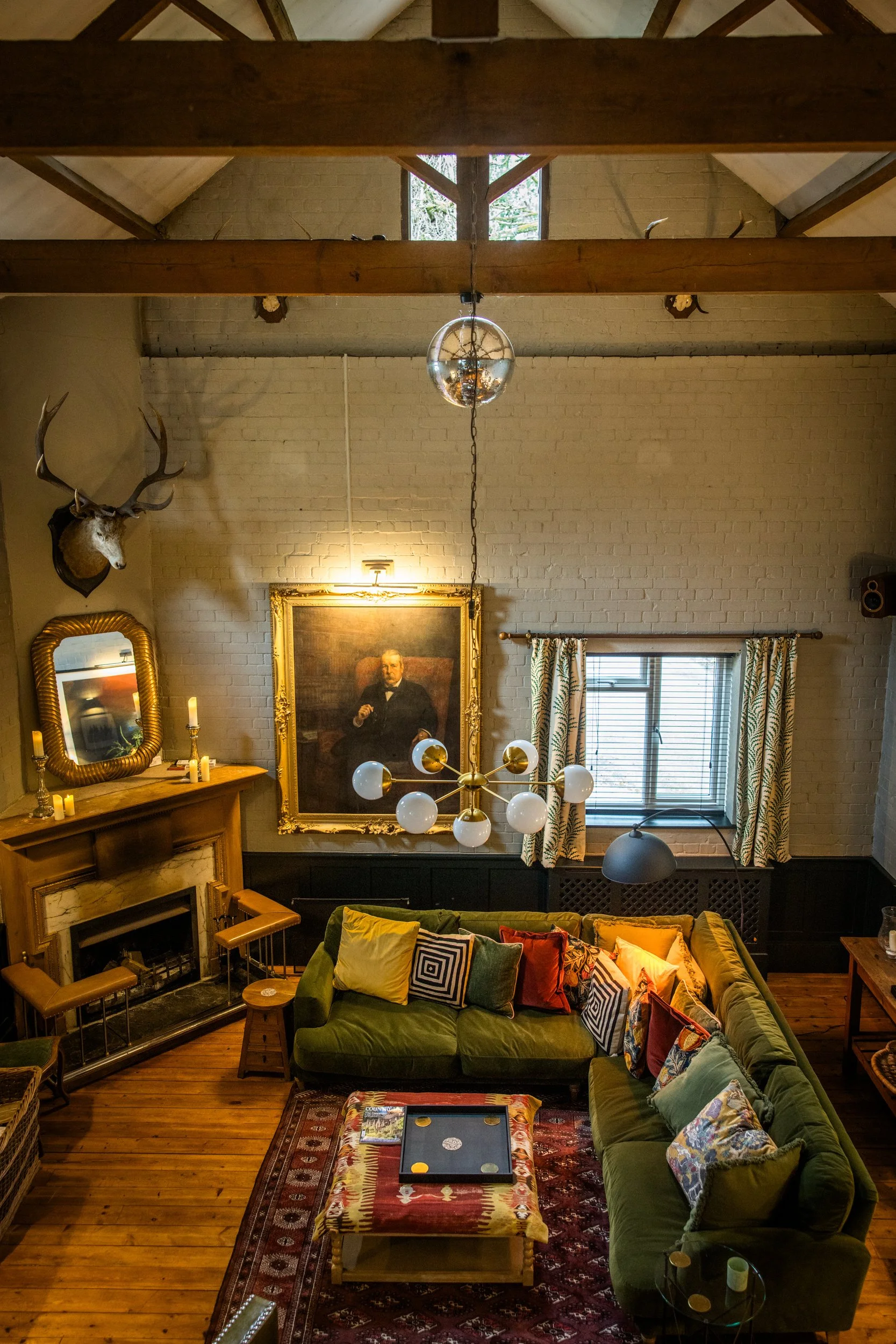 Interior of the Loyton Lodge lounge featuring traditional timber beams and classic decor.