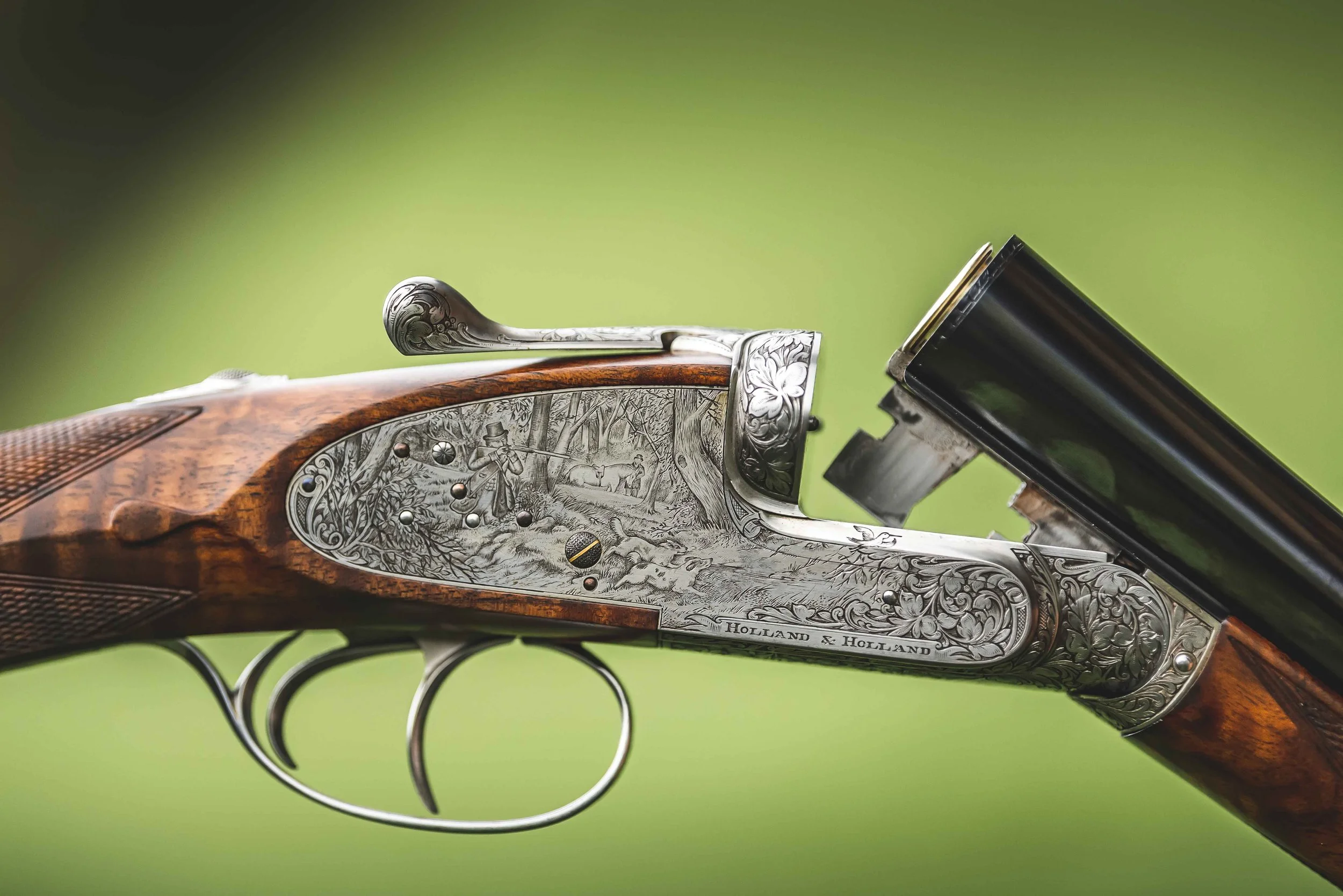 Close-up of an intricately engraved Holland & Holland shotgun at Loyton.