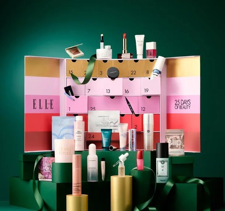 Luxury beauty advent calendar gift box with open drawers showing products, perfect for festive gifting.