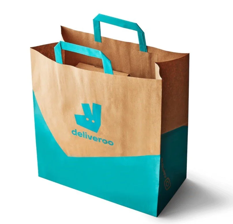 Brown kraft paper bag with turquoise flat handles and print, ideal for premium retail use.