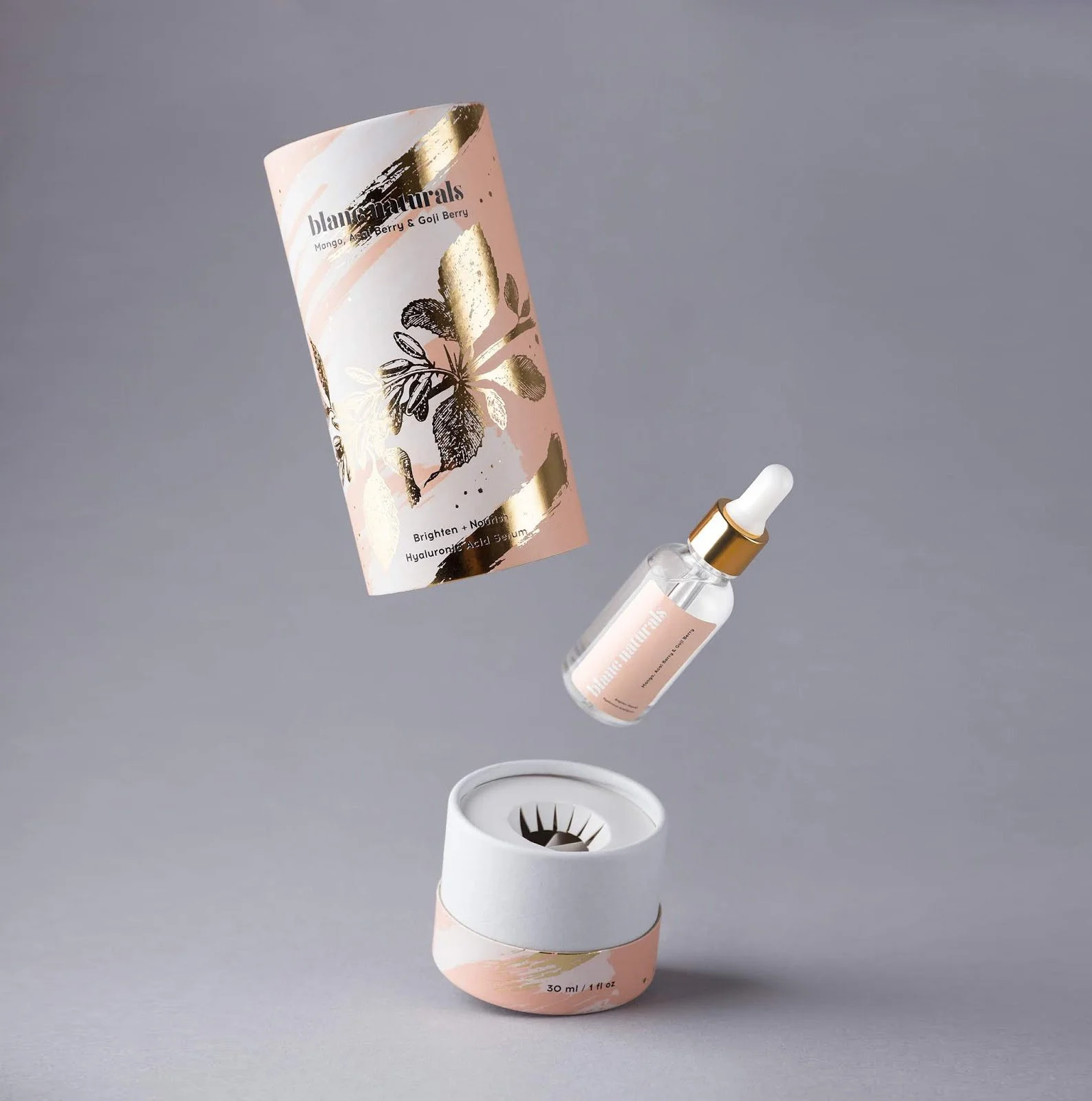 Luxury pink, white, and rose gold foil tube with beauty dropper, perfect for premium skincare products.