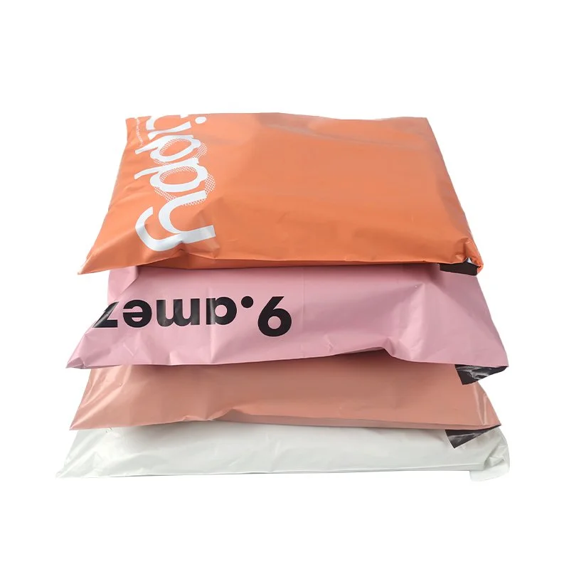 Stack of colourful poly mailing bags with unique branding, ideal for e-commerce packaging.