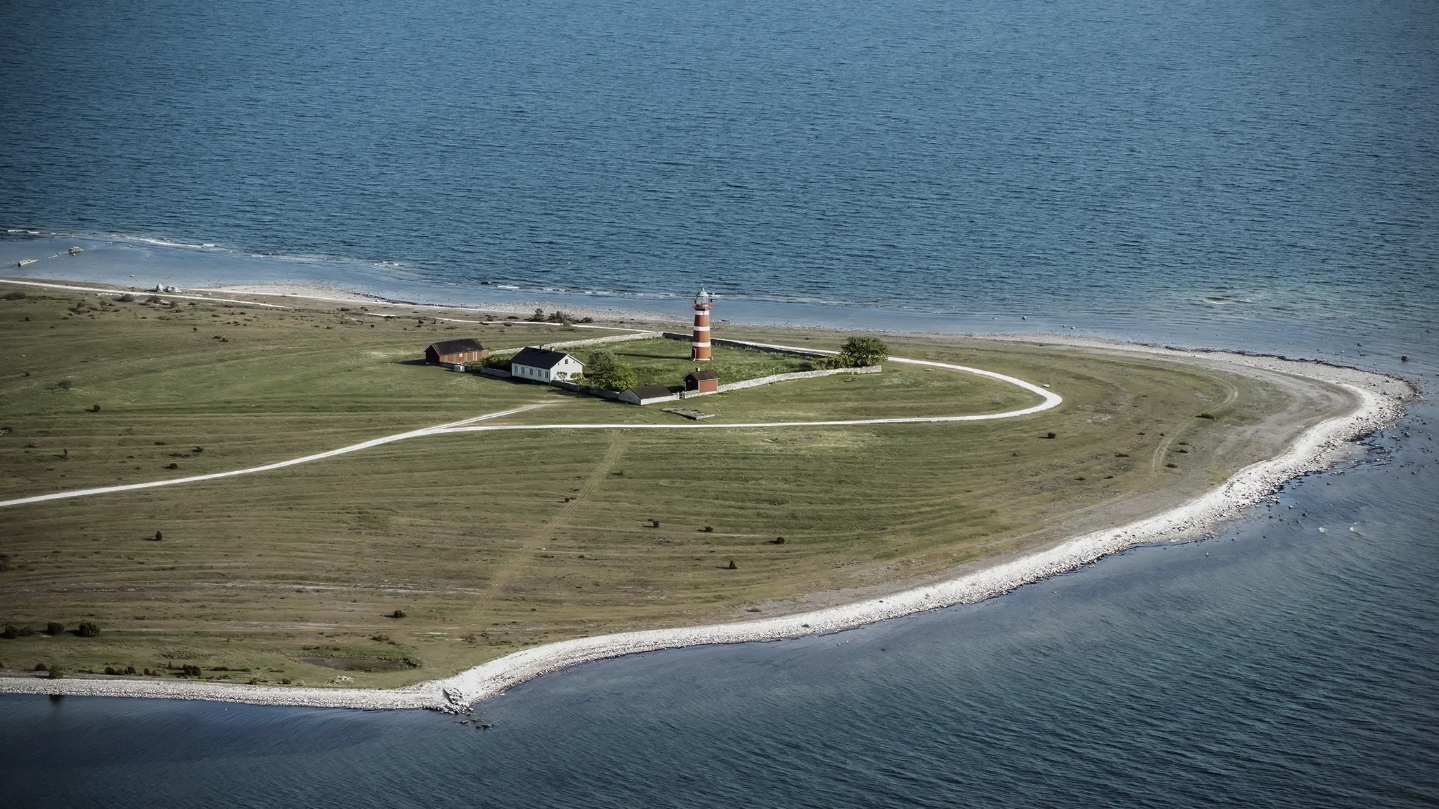 Gotland Film Location - aerial view of a lighthouse on a cape
