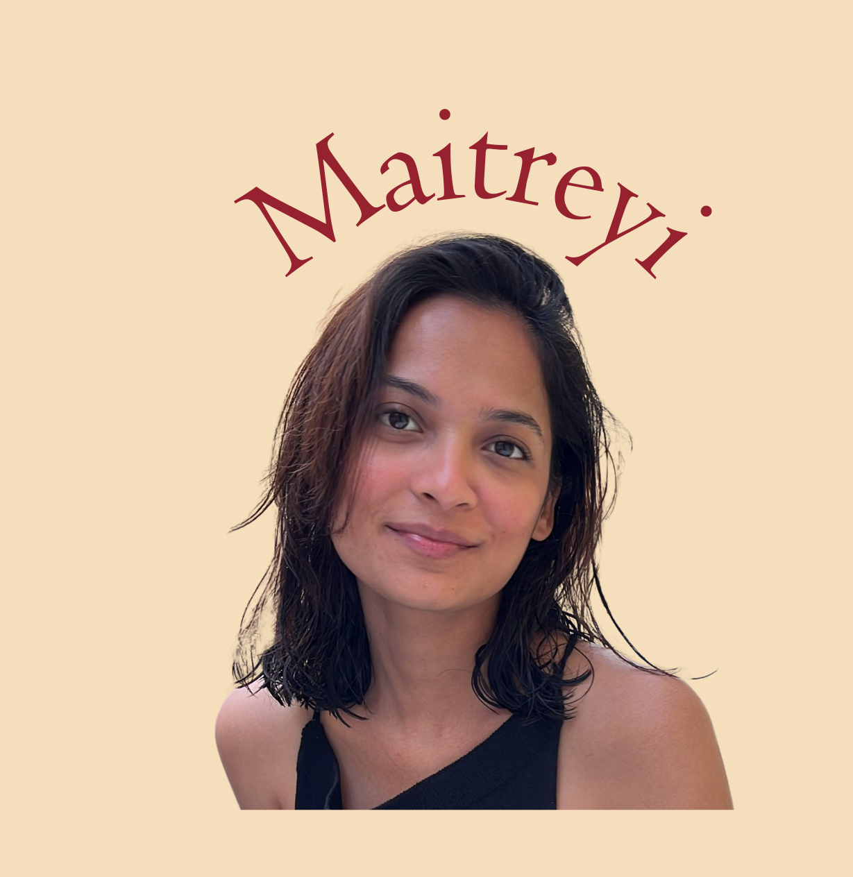 A woman with shoulder-length dark hair, wearing a black sleeveless top, is smiling gently at the camera against a beige background. The name 'Maitreyii' appears above her head in red stylized font.