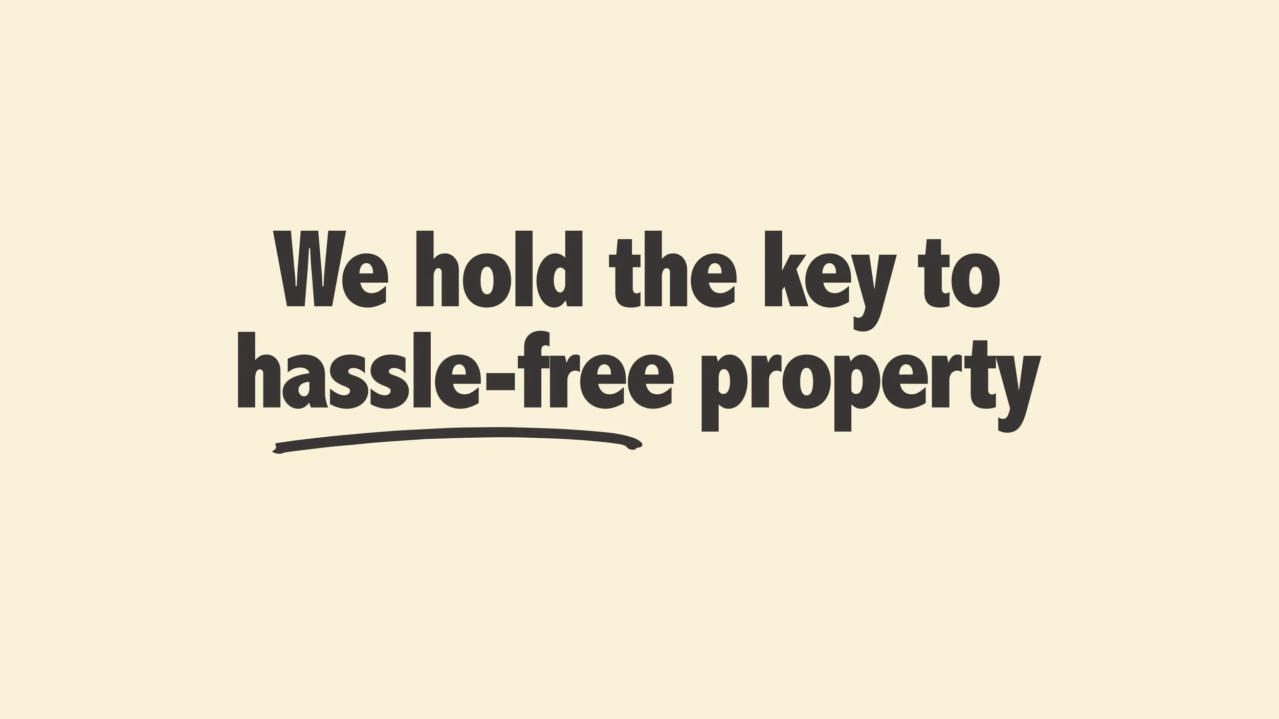 Text on a beige background that reads, "We hold the key to hassle-free property" with an underline beneath the last part.