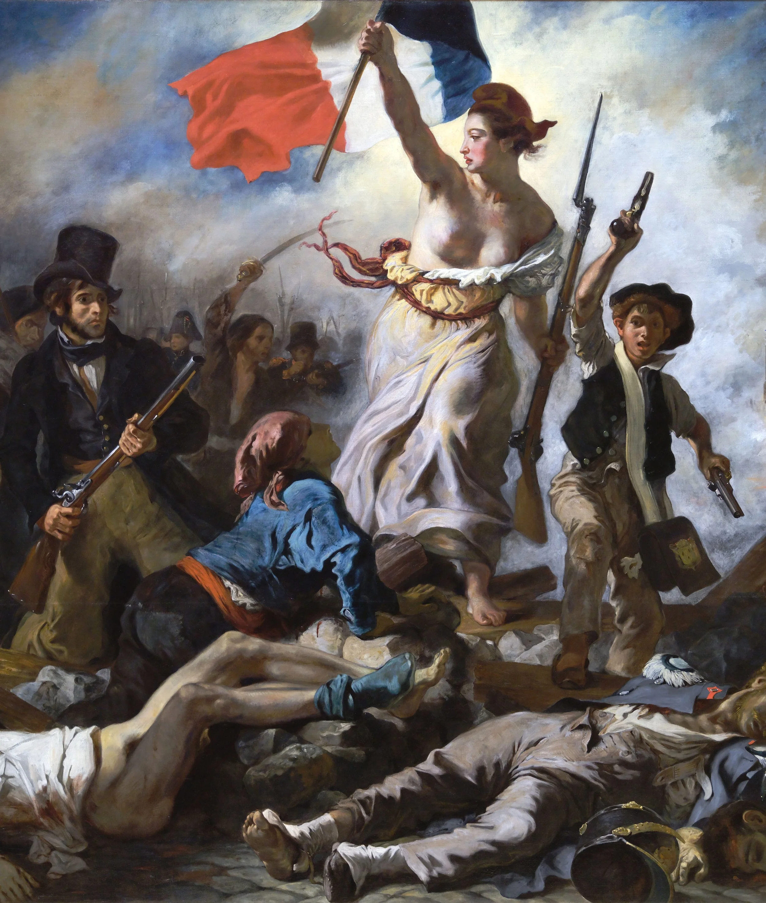 A painting of a woman holding a French flag, leading a charge with soldiers around her during a battle, with fallen soldiers on the ground.