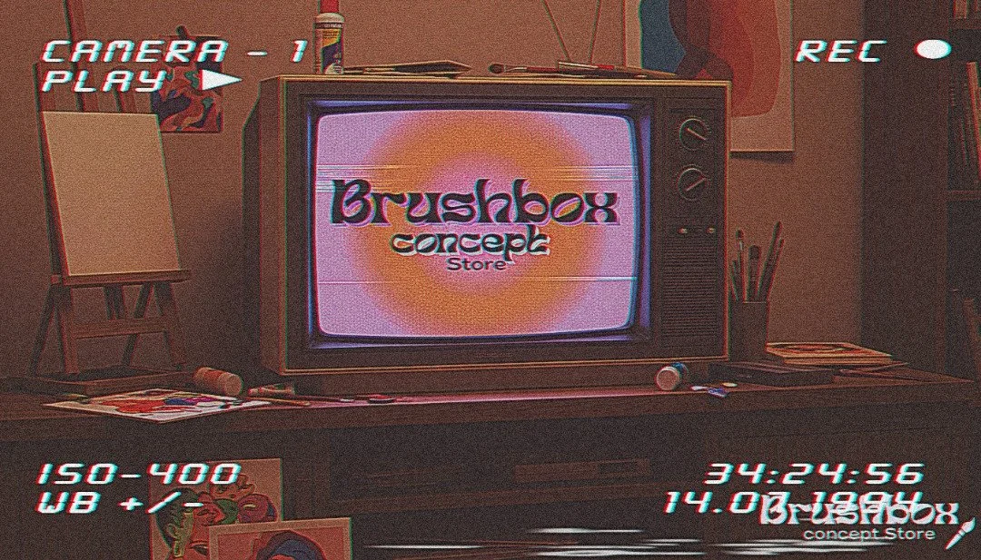 A vintage television displaying the logo for 'Brushbox Concept Store' surrounded by art supplies and decor in a dimly lit room with a retro aesthetic.