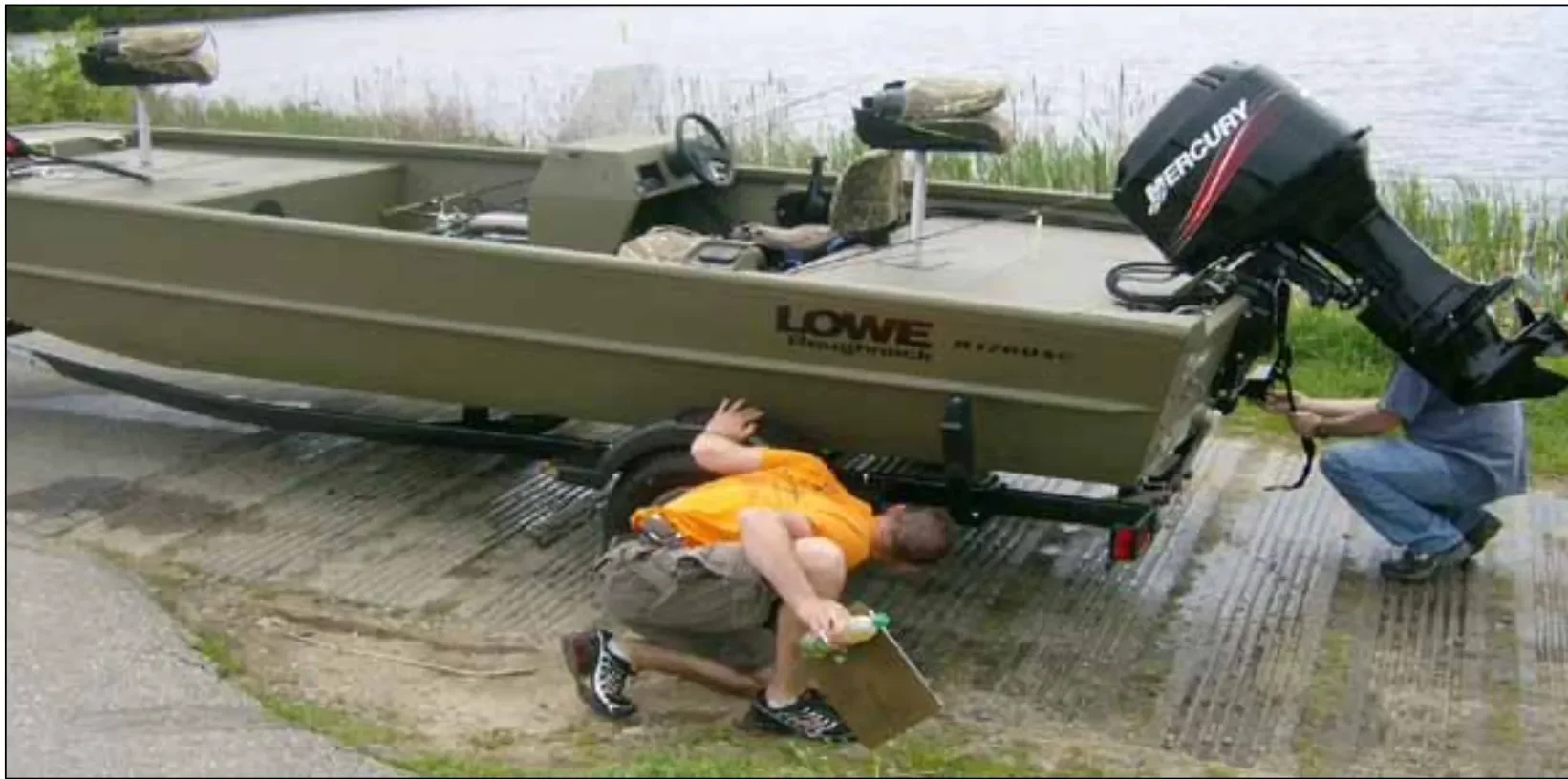 Boat being inspected by volunteer before going into the pond