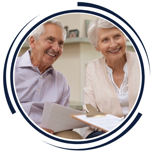 An elder couple discussing the sale of their family home with a realtor who understands.