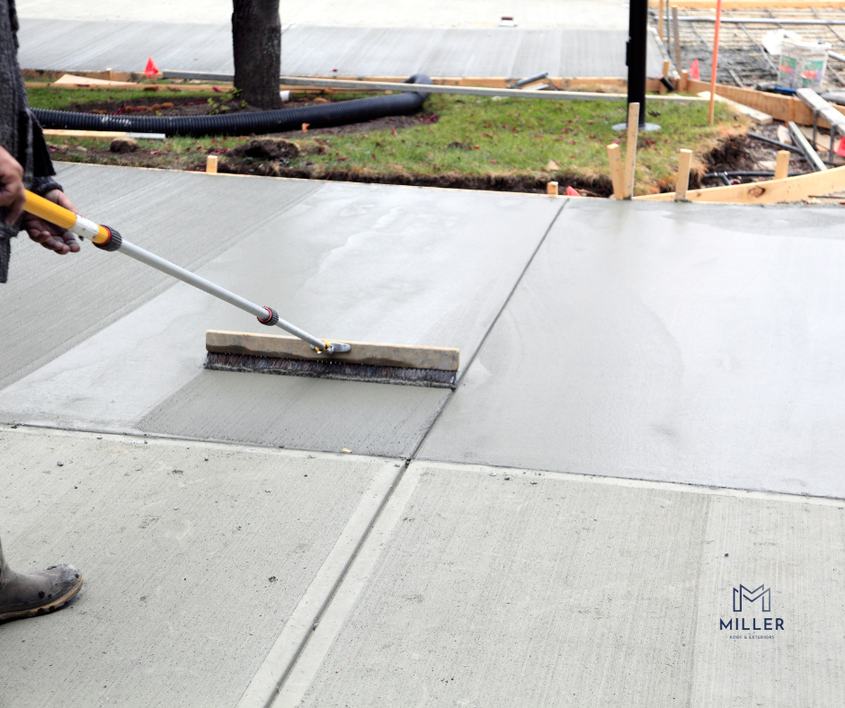 Concrete contractor smoothing fresh sidewalk concrete during residential installation in Tulsa, Oklahoma