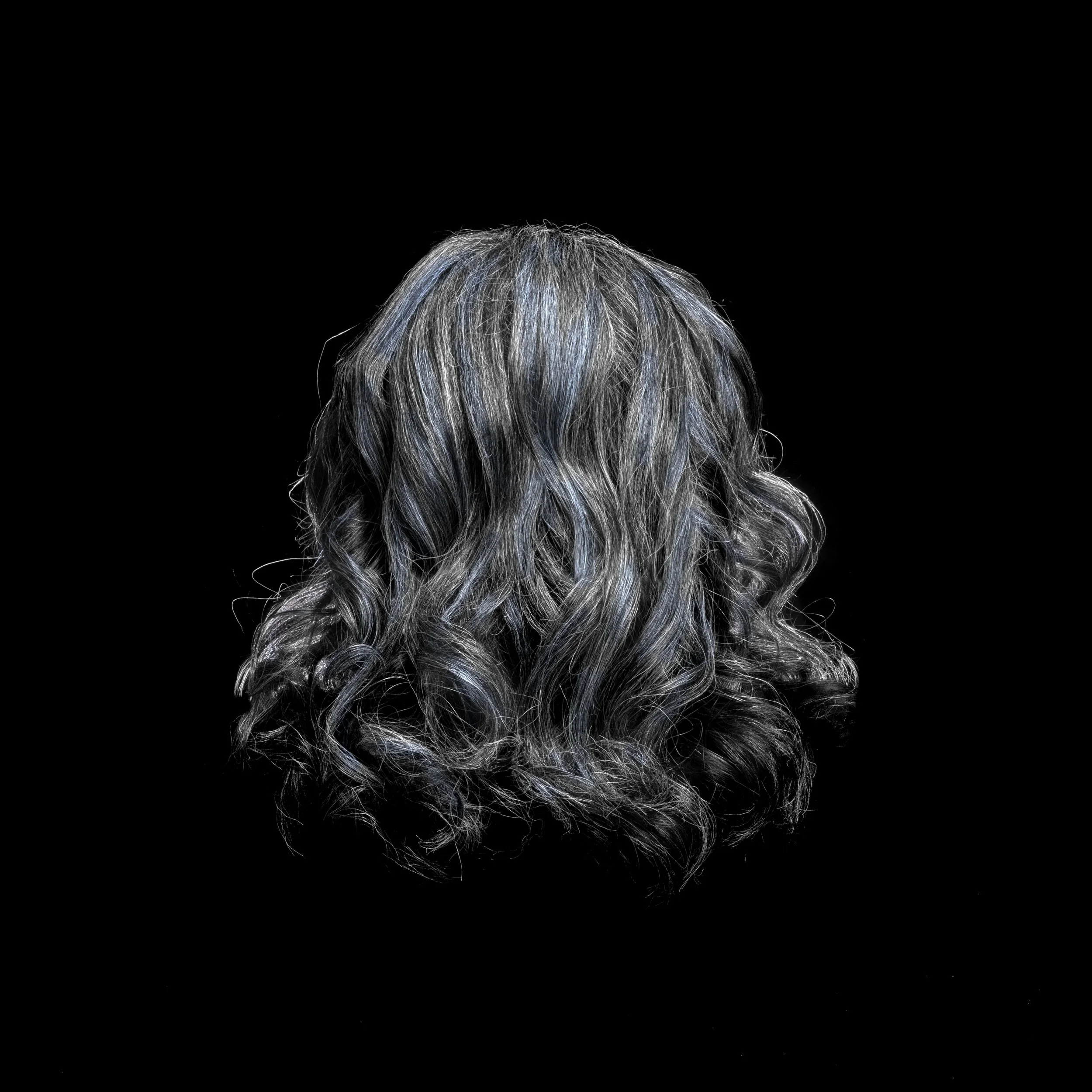 Back view of curly, silver-gray hair on a black background.