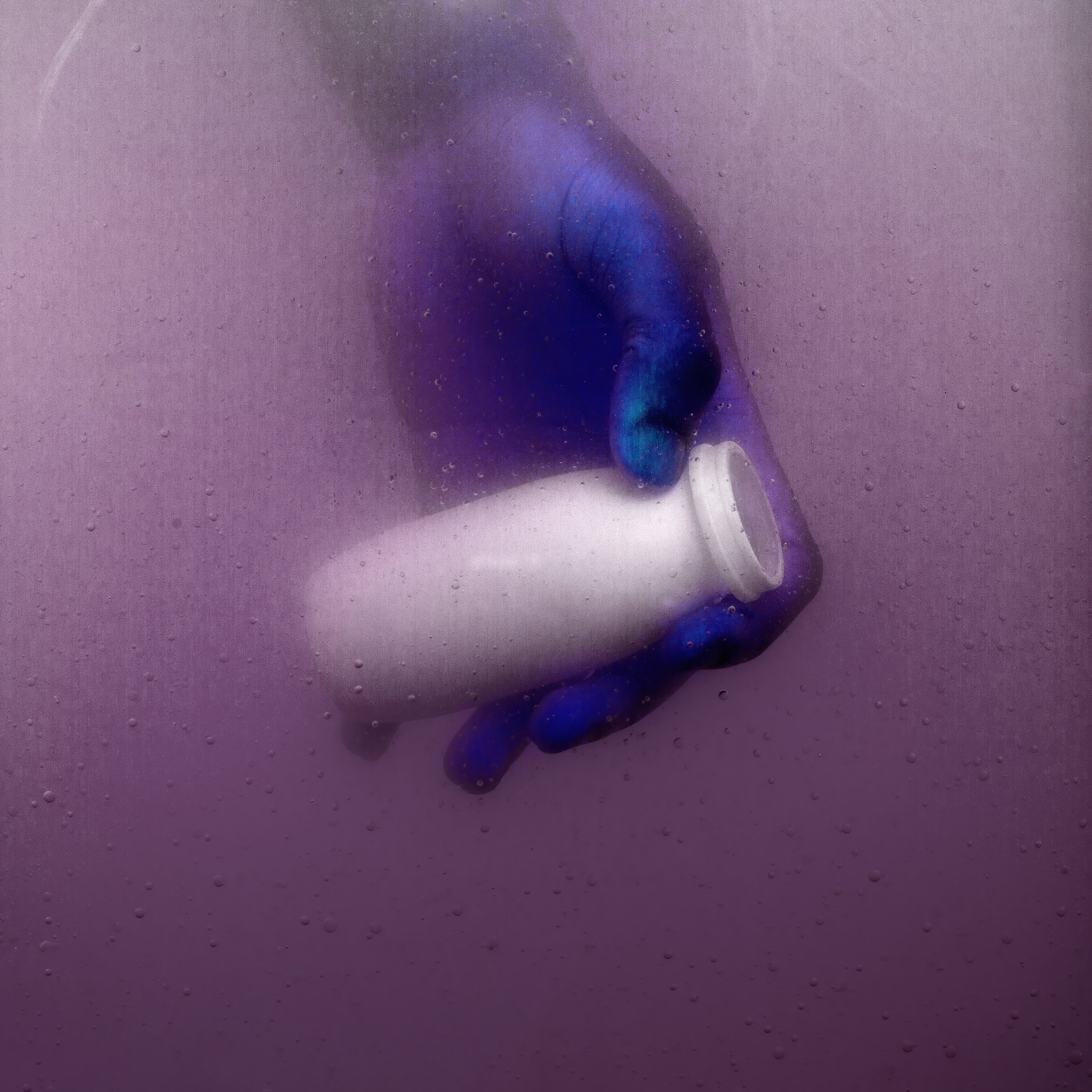 A hand wearing a blue glove holding a white plastic container or cup against a purple, foggy background with small water droplets.