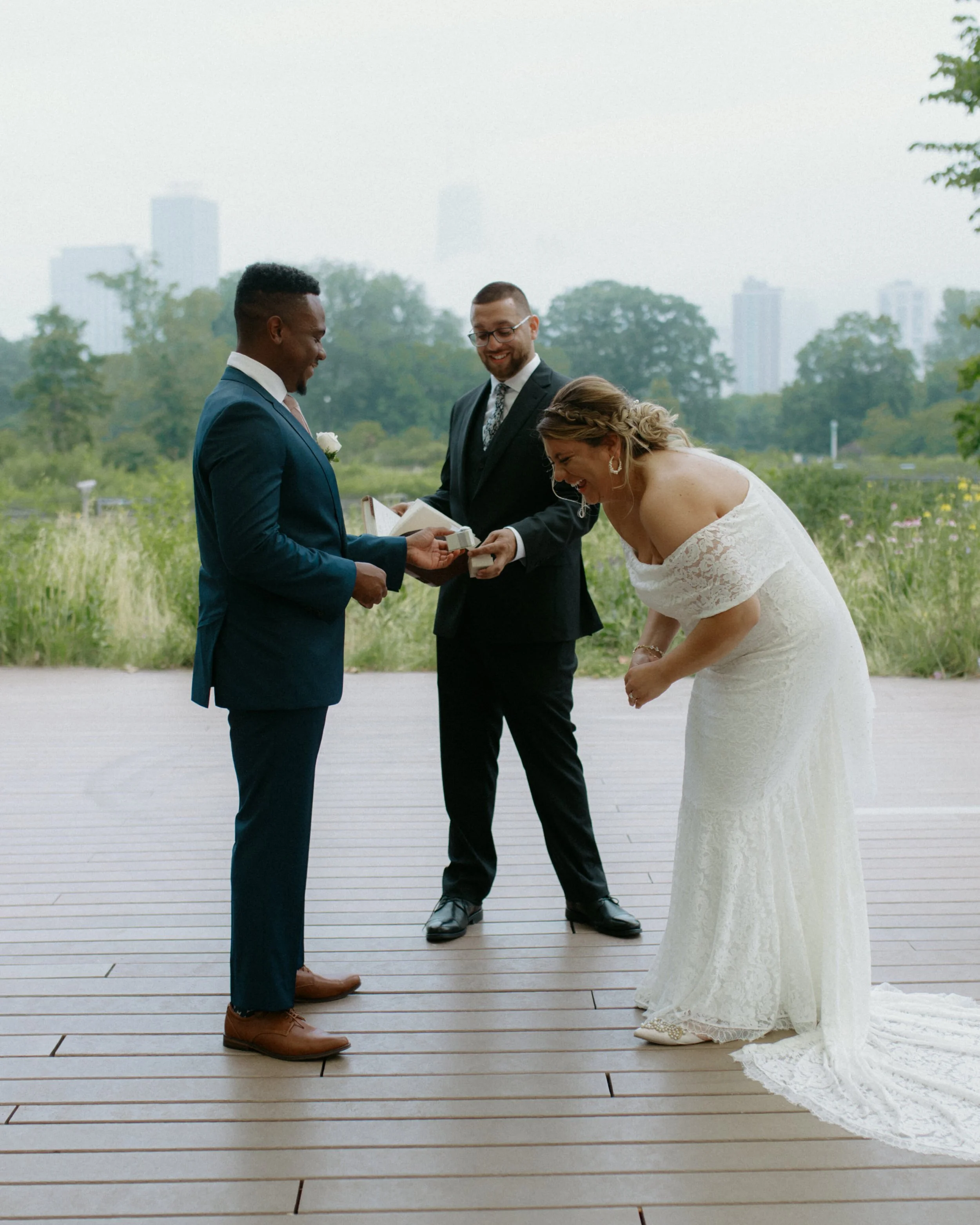 Intimate elopement ceremony at Lincoln Park Chicago with city skyline in background, Chicago elopement photographer Nicole Kilday