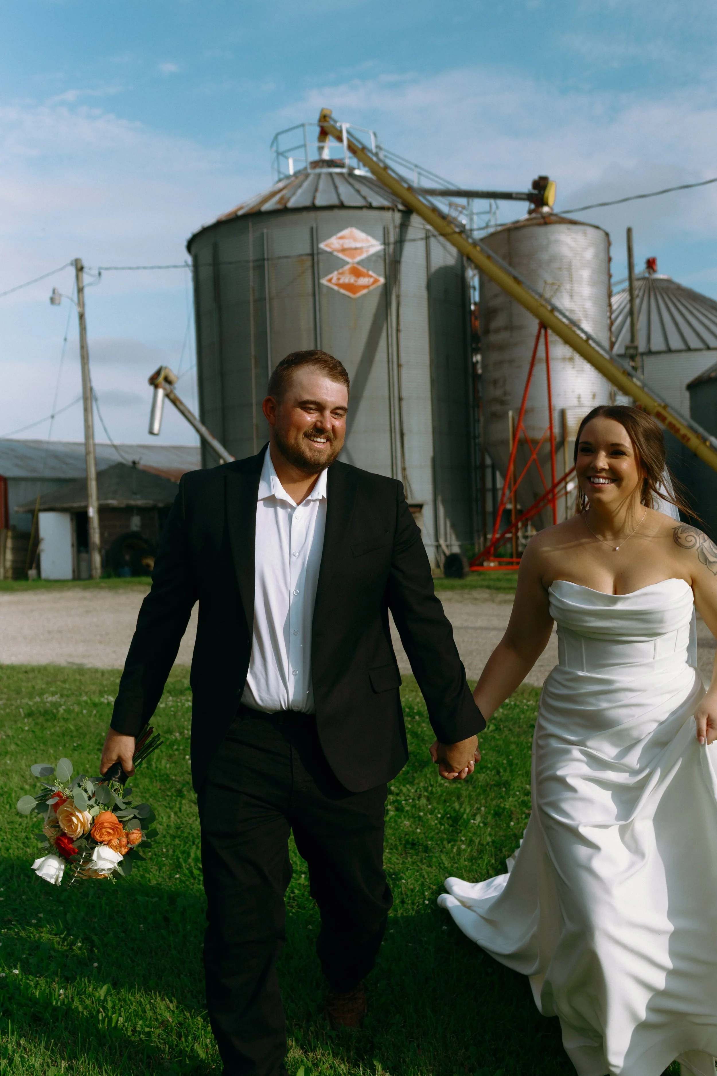 Candid bride and groom portrait at a family farm wedding in Kansasville Wisconsin photographed by Nicole Kilday Photography